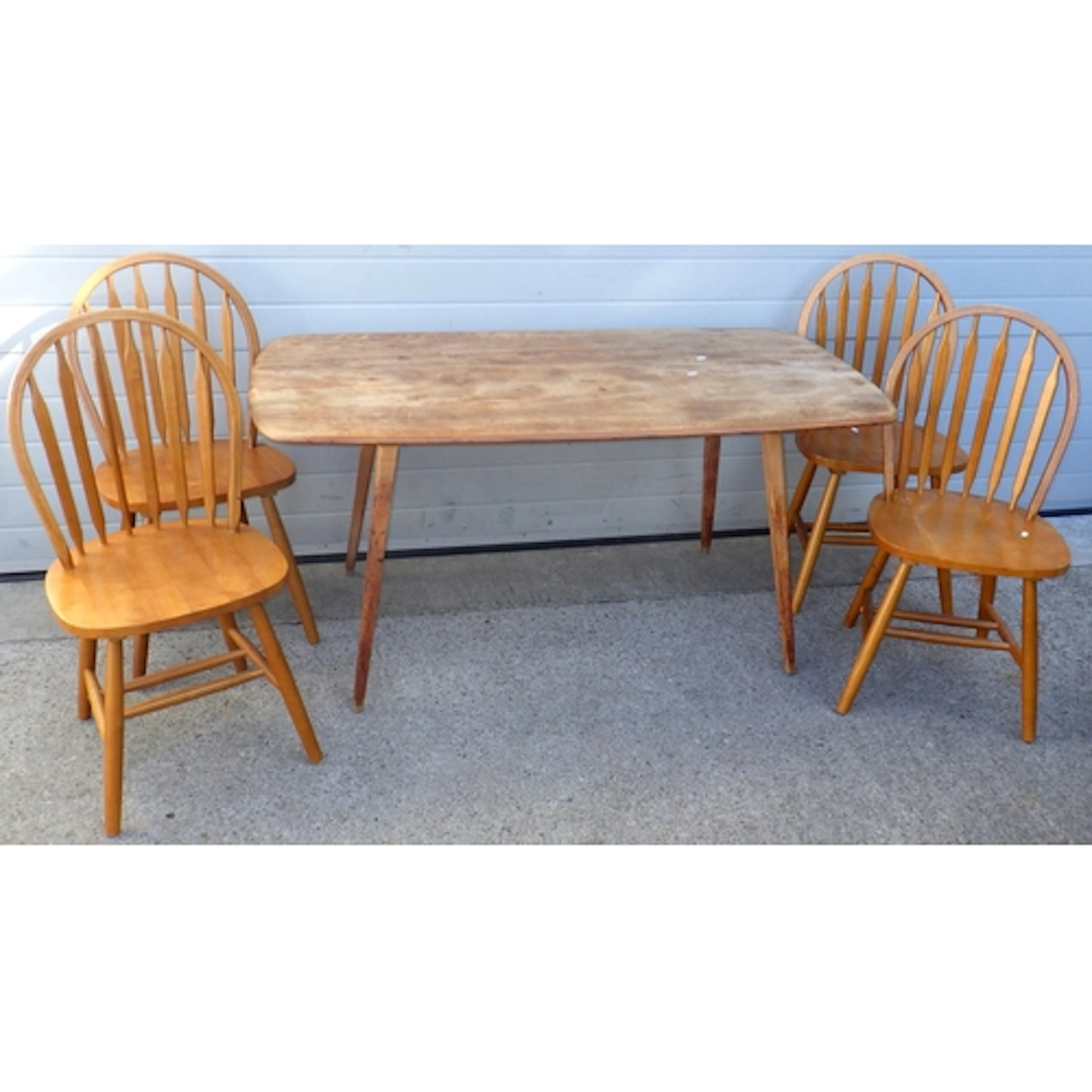An Ercol dining table, marks, 153cm long, together with fou...
