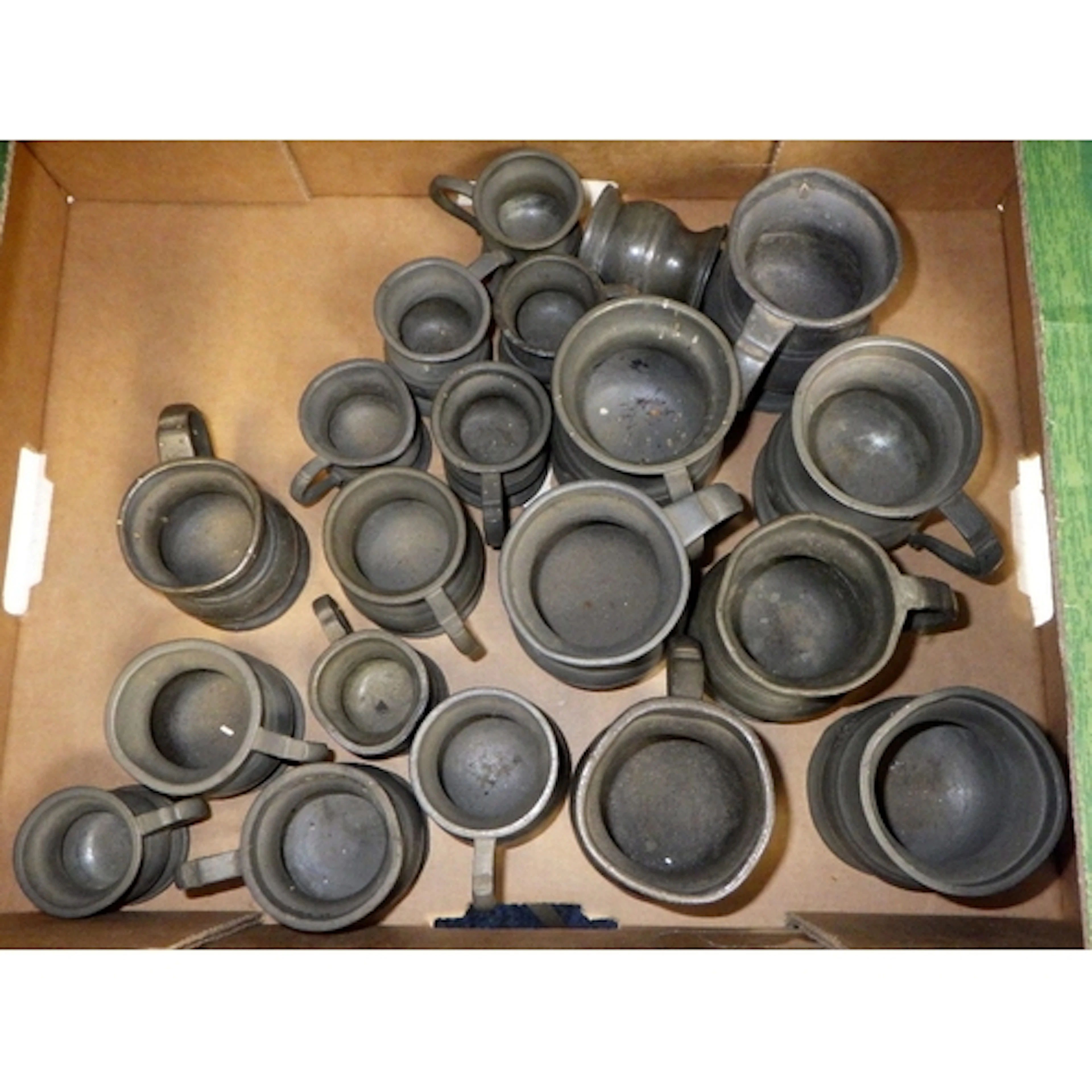 A large qty of small pewter tankards