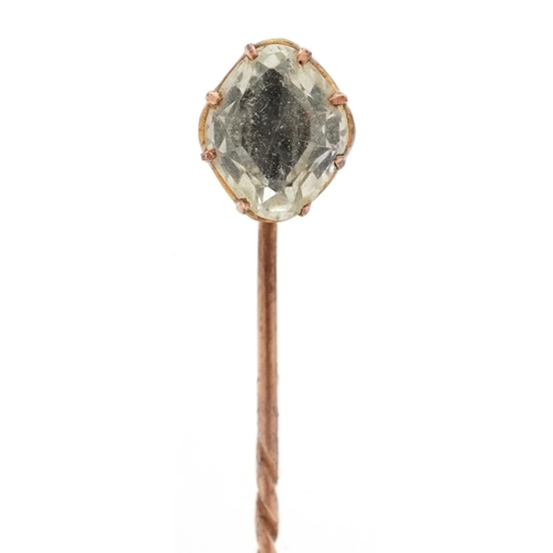 Yellow metal blue stone stickpin, 7.6cm in length, 2.7g, hou...