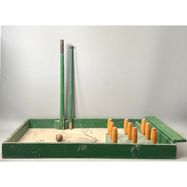 A vintage skittle bowl game - green painted pine and bras...