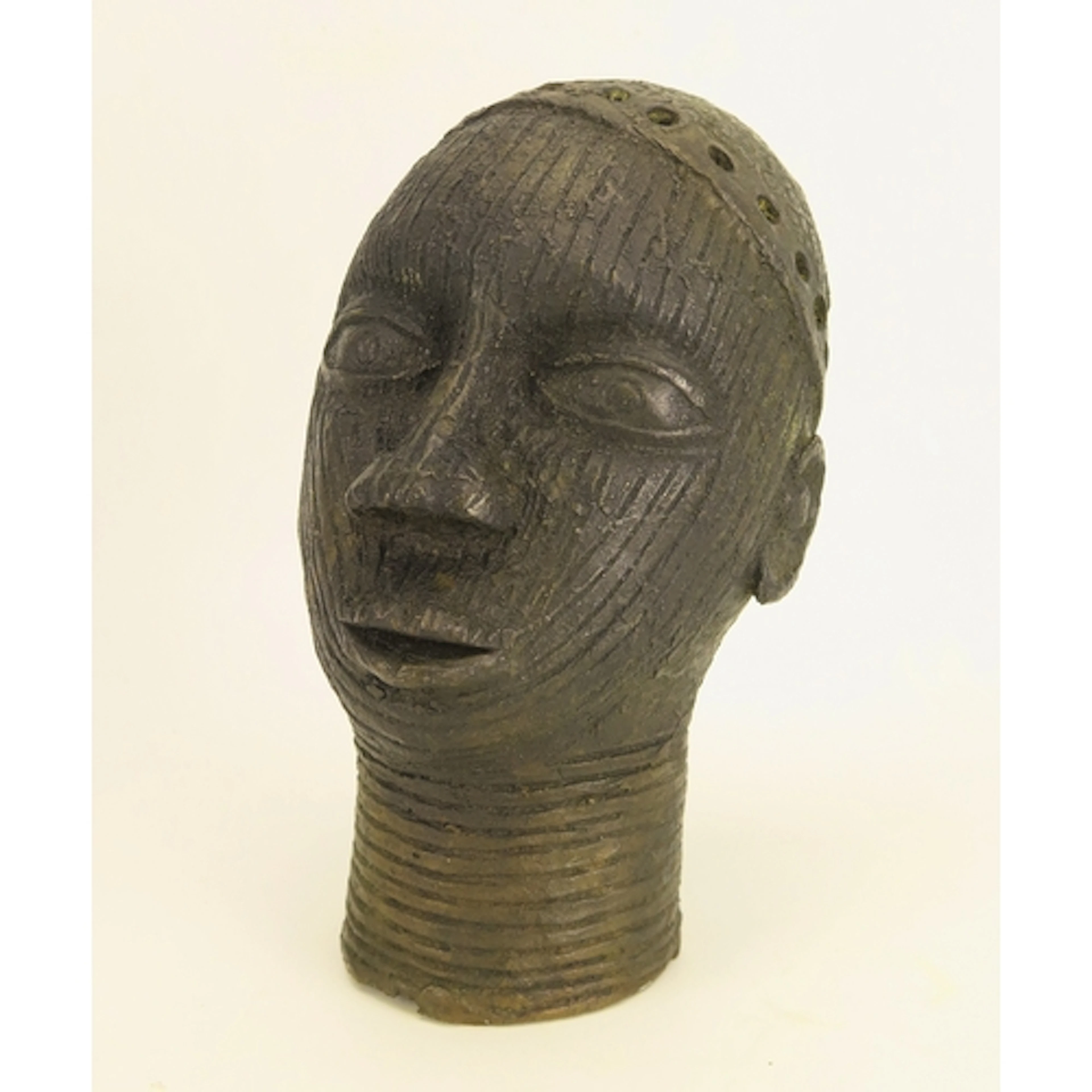 A Benin bronze head with scarification and neck rings, 18cm...