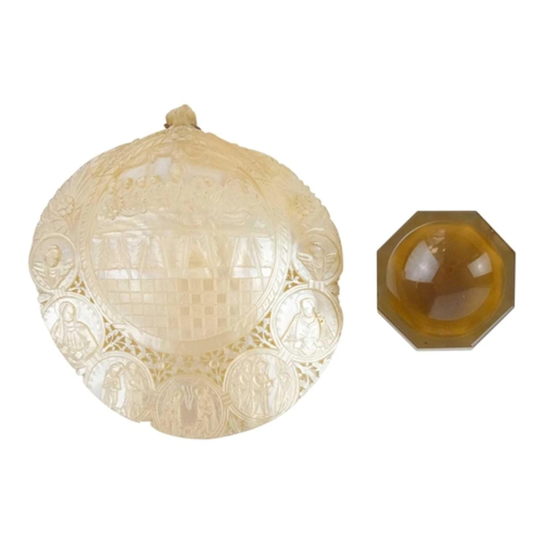 A carved mother of pearl pilgrim's shell plaque. 19th centur...