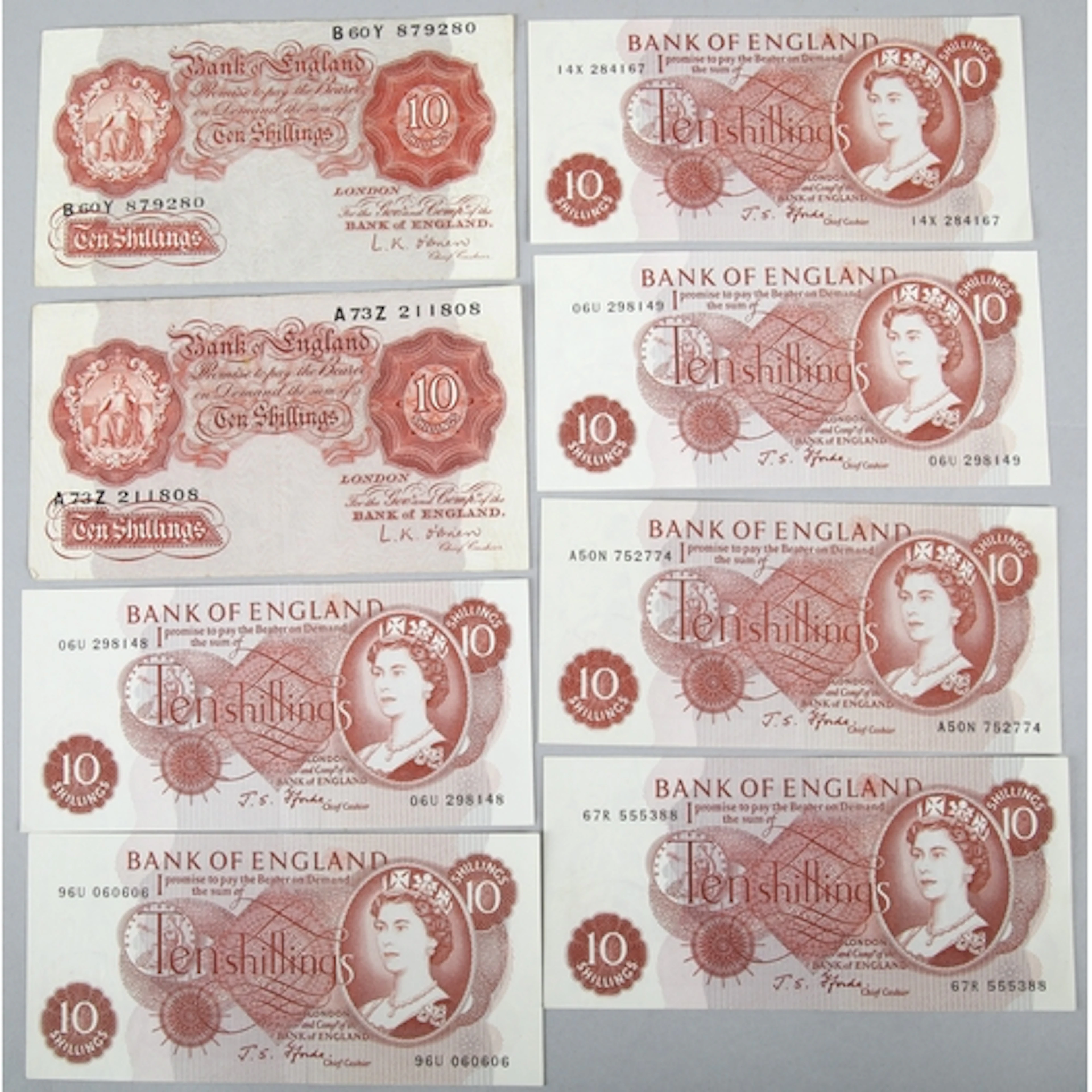 Eight Bank of England ten shilling notes.