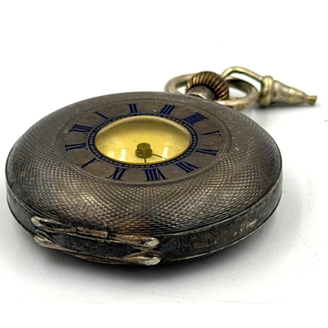 A silver machine tooled half hunter pocket watch, marked 935...
