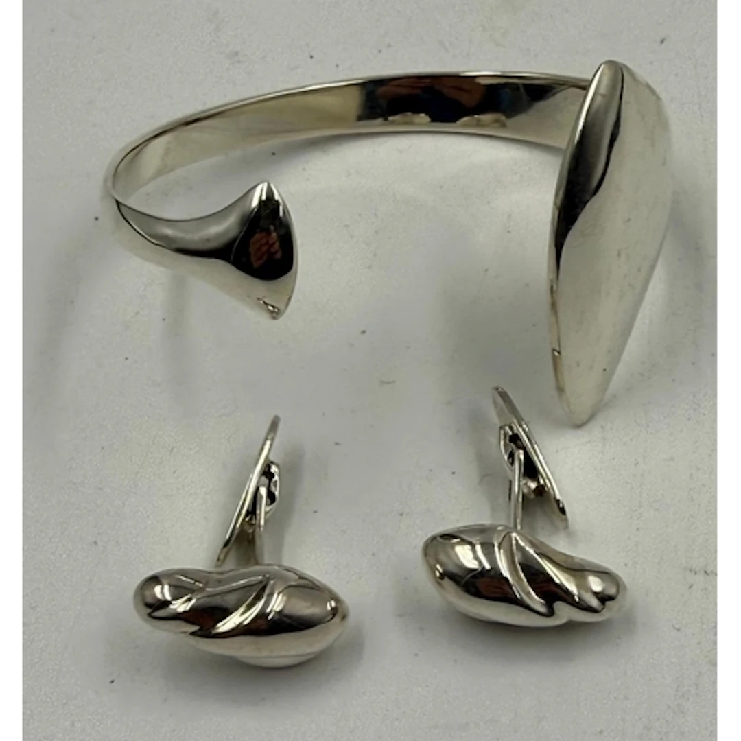 A Georg Jensen silver bangle and a pair of Georg Jensen cuff...