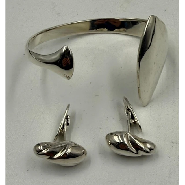 A Georg Jensen silver bangle and a pair of Georg Jensen cuff...