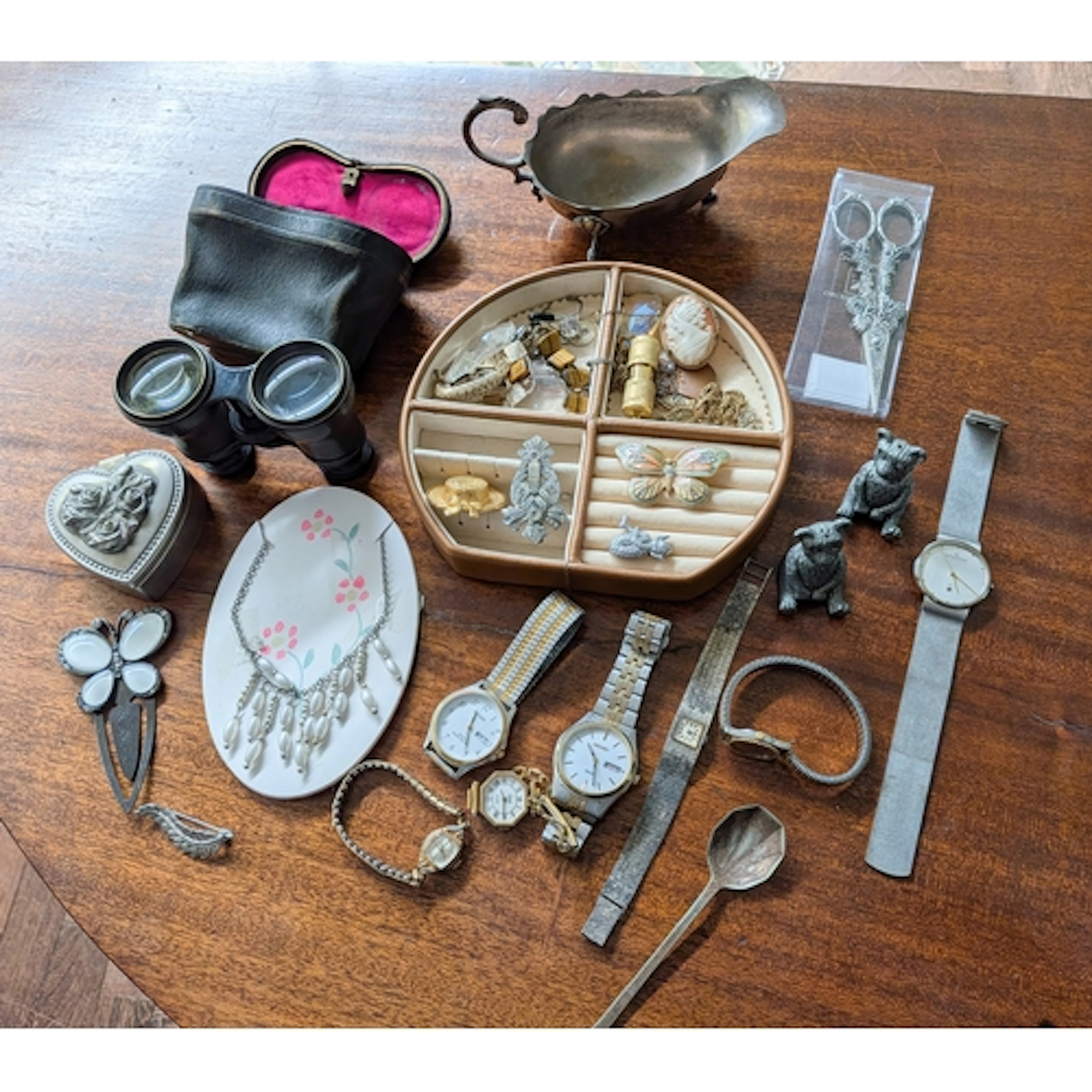 A cased pair of vintage binoculars together with costume jew...