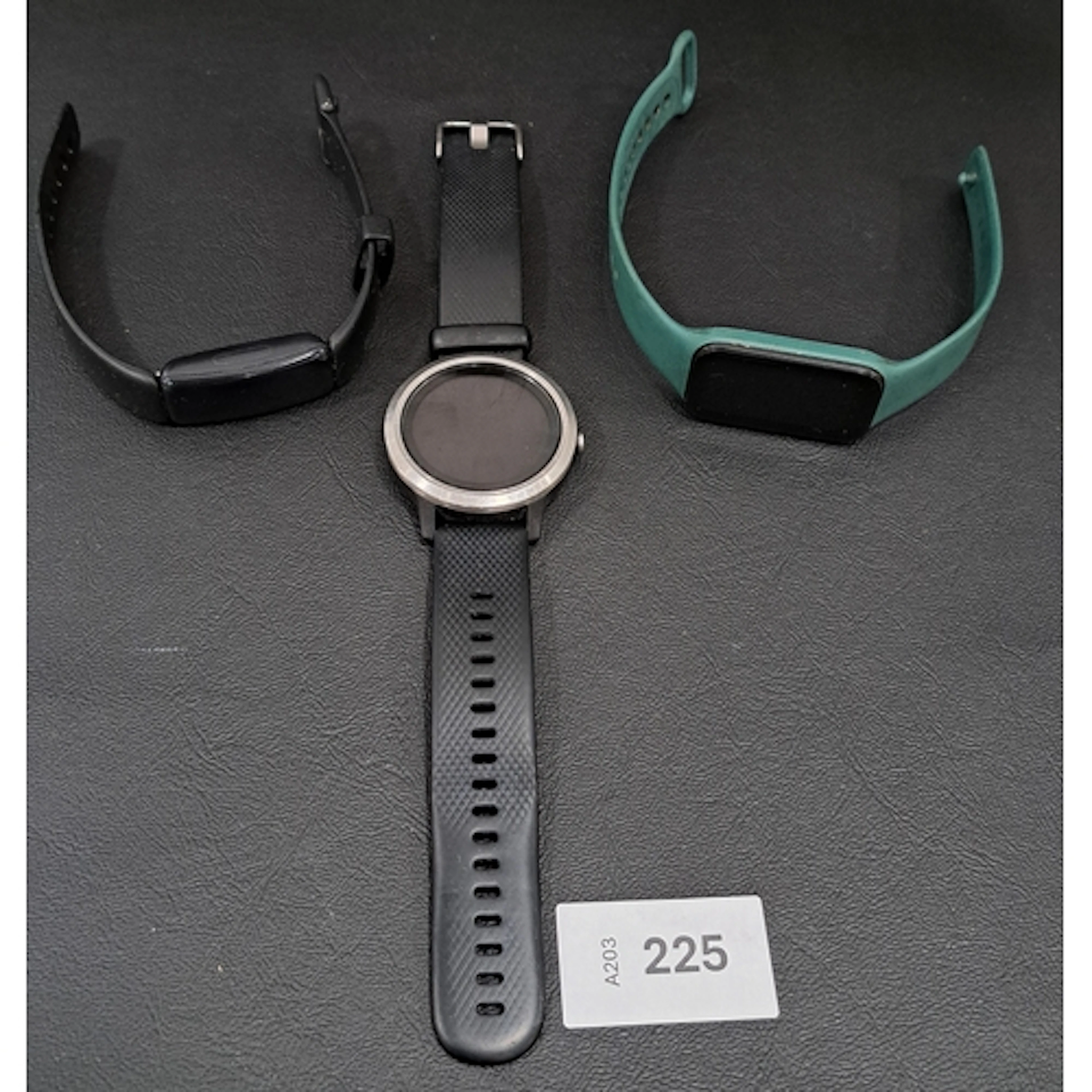 THREE FITNESS TRACKERS comprising Garmin vivoactive, Fitbit ...