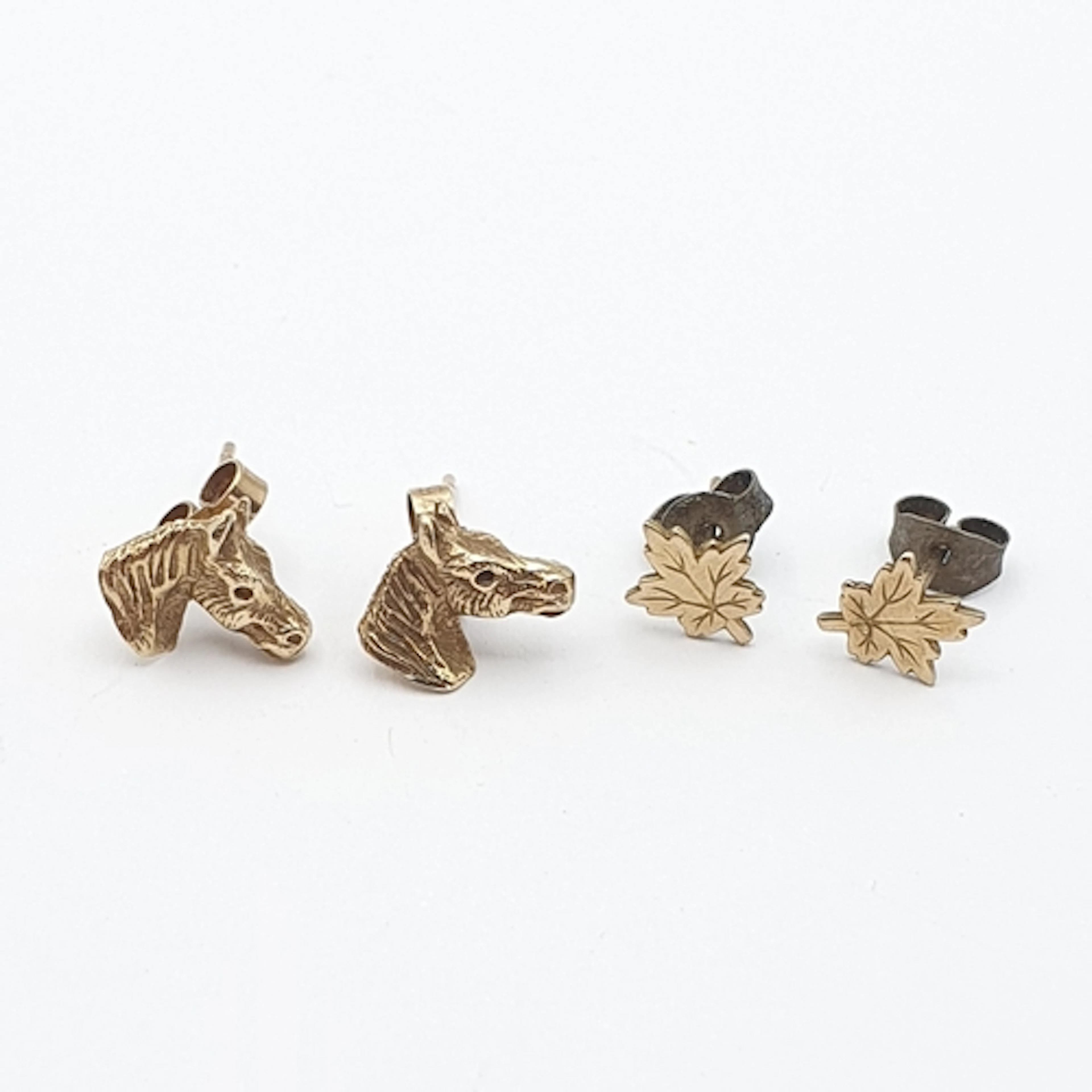 A pair of 9ct gold Horse's Head Earrings and a pair of 9ct g...