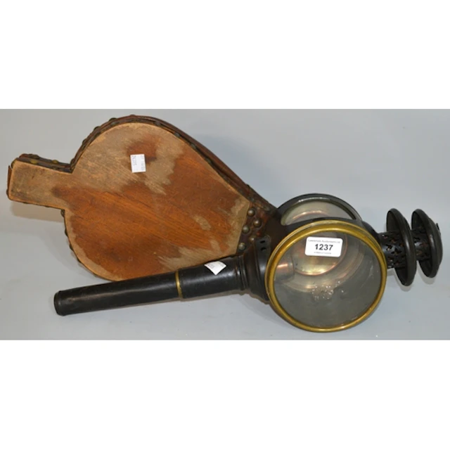 Early black japanned and brass coaching lamp and a pair of w...