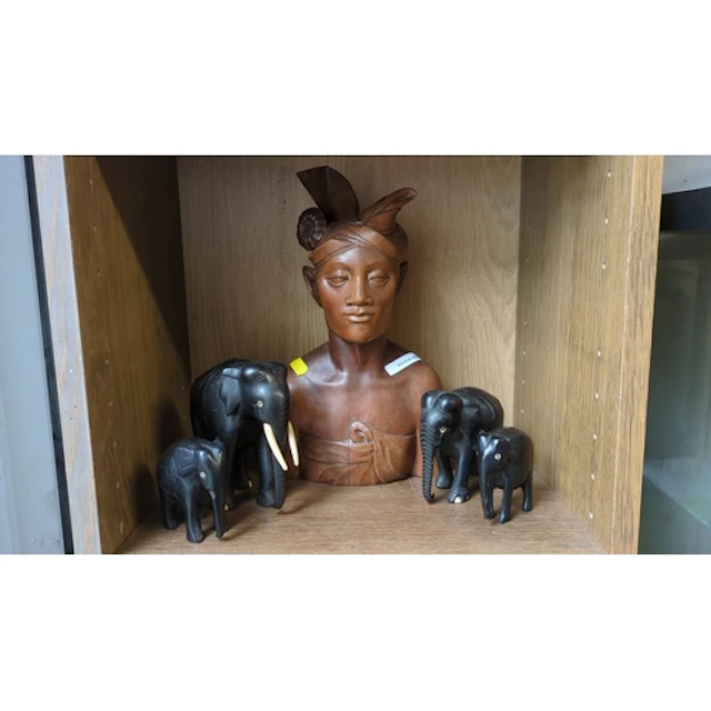 A group of carved wooden figural sculptures comprising a fem...