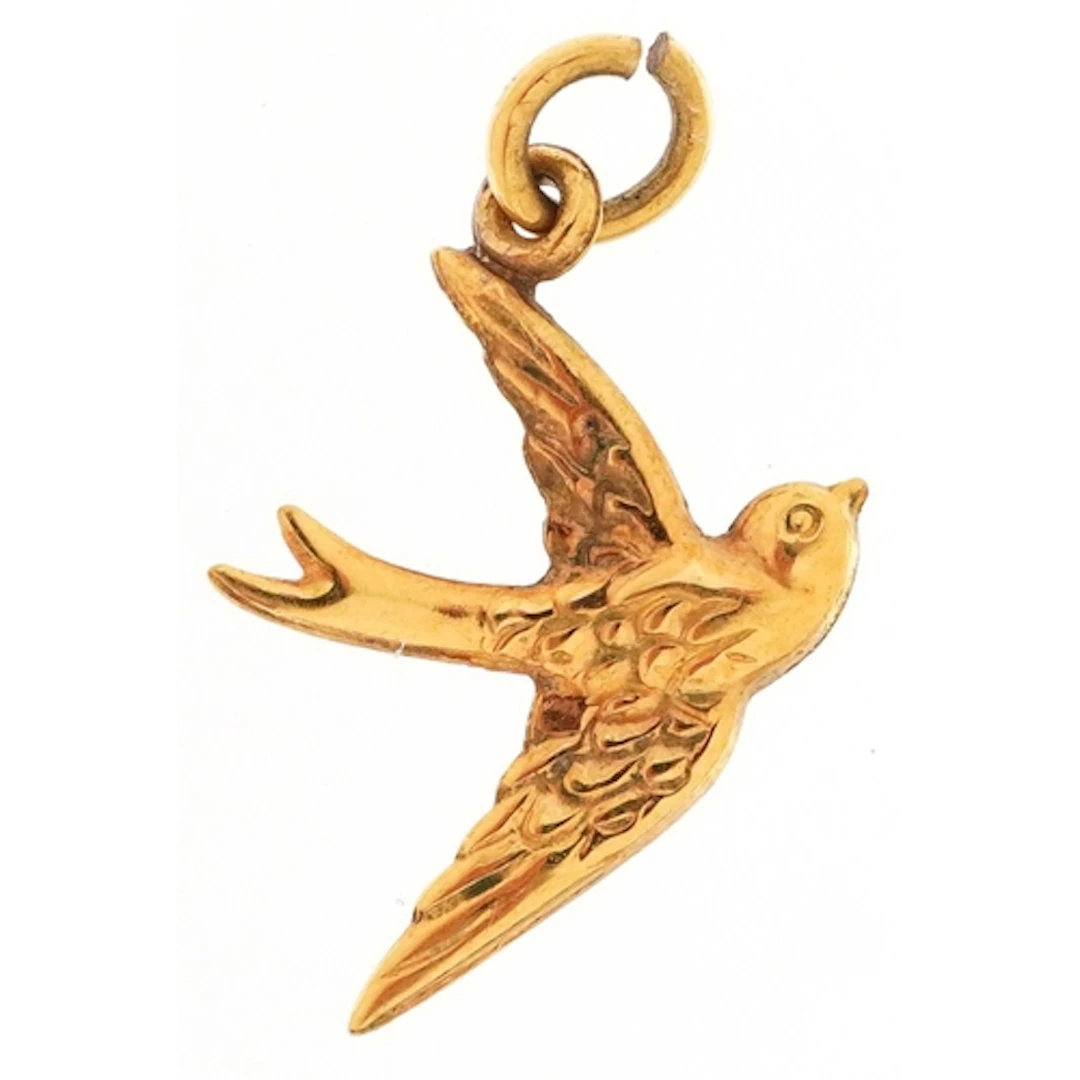 9ct gold charm in the form of a swallow, 2cm high, 0.3g.