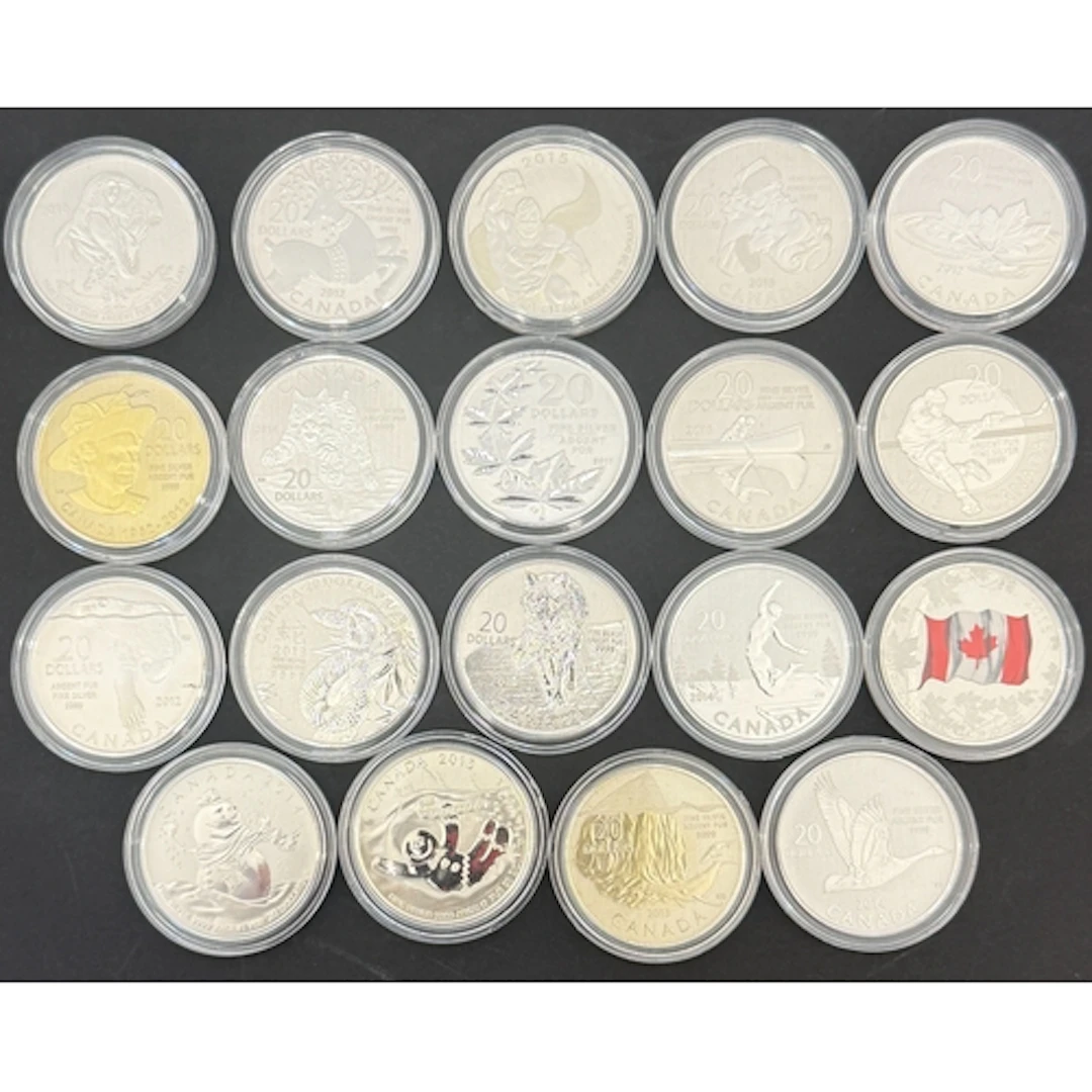A collection of 19 Canadian fine silver coins, comprising $2...