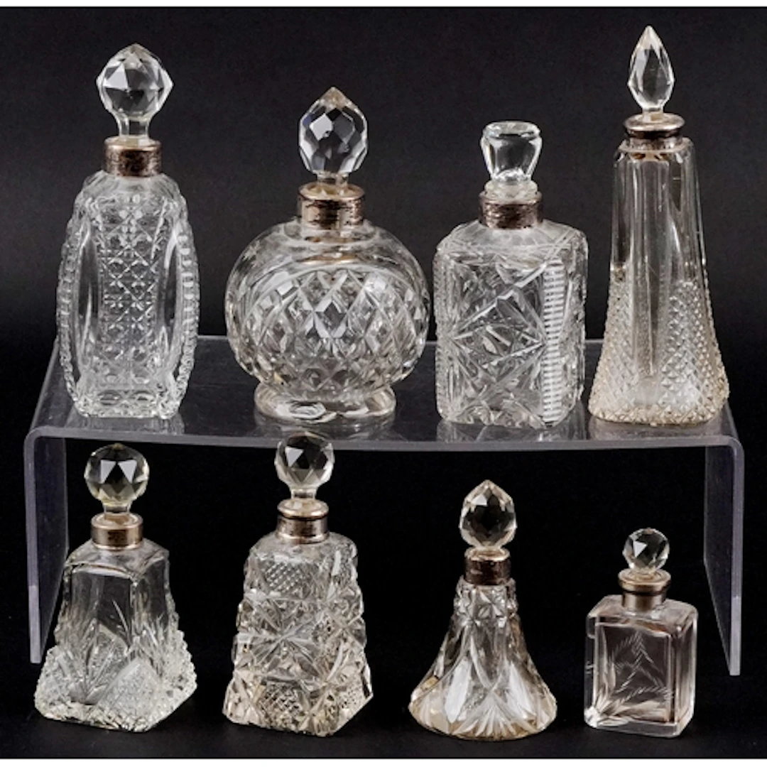 Eight 19th/20th century cut glass scent bottles with silver ...