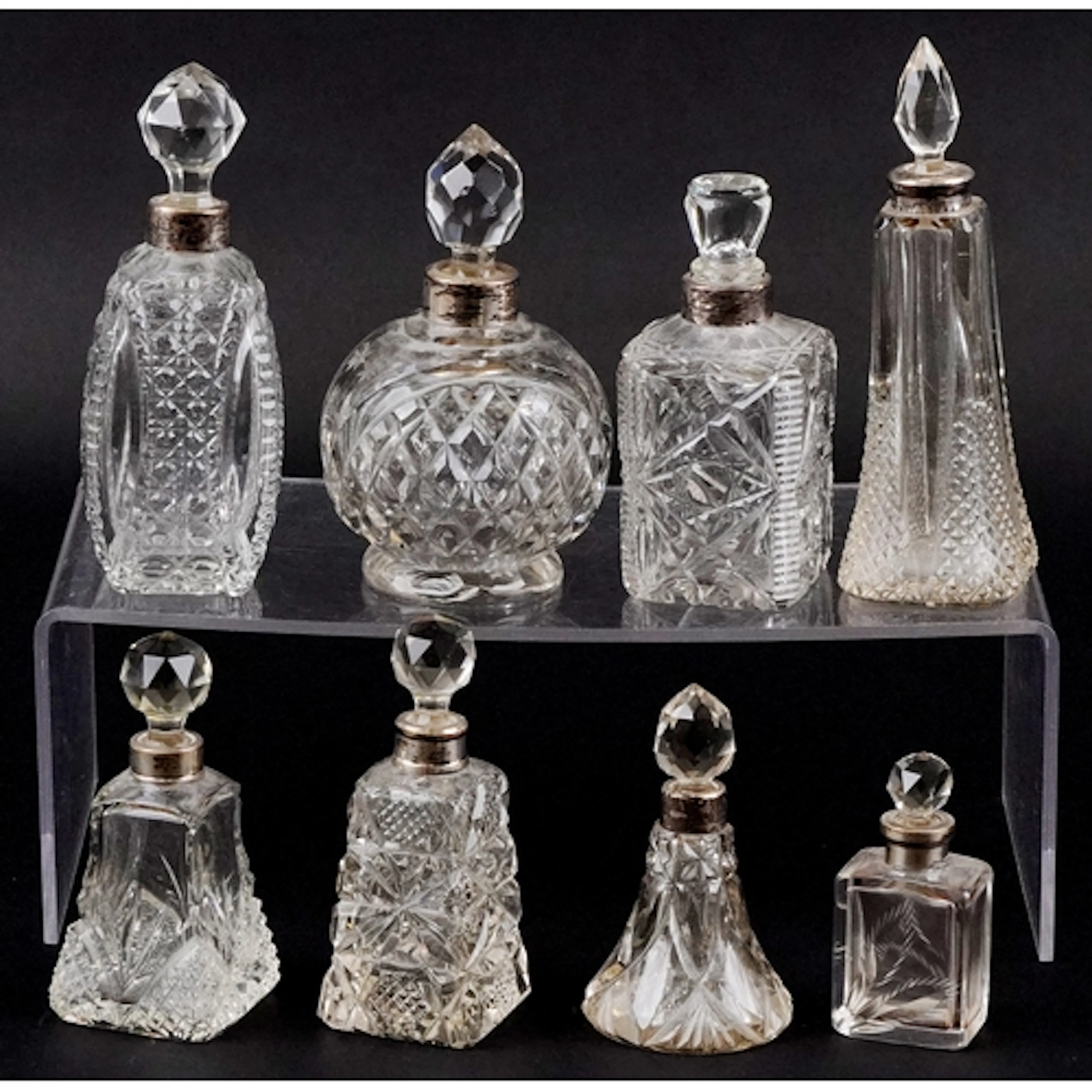 Eight 19th/20th century cut glass scent bottles with silver ...