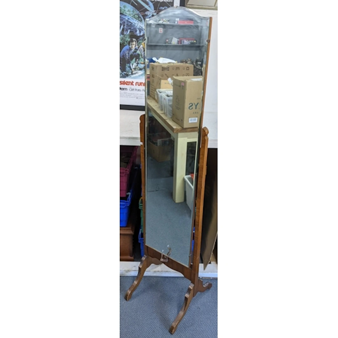 A mid 20th century walnut cheval mirror with bevelled glass ...