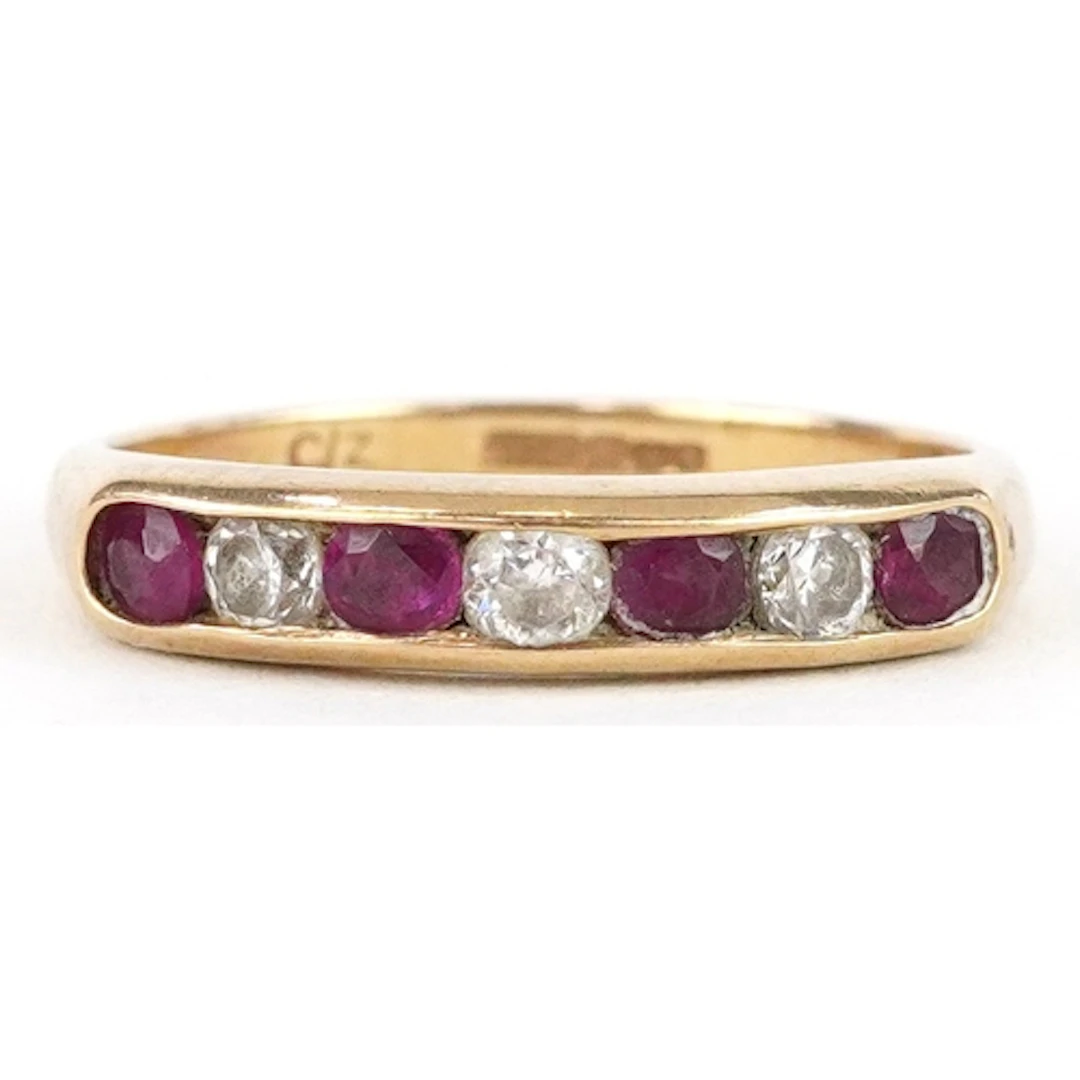 9ct gold pink stone and cubic zirconia half eternity ring, s...