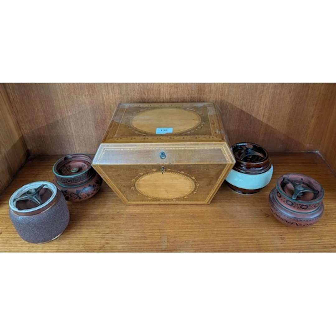 An Edwardian inlaid casket shaped trinket box together with ...