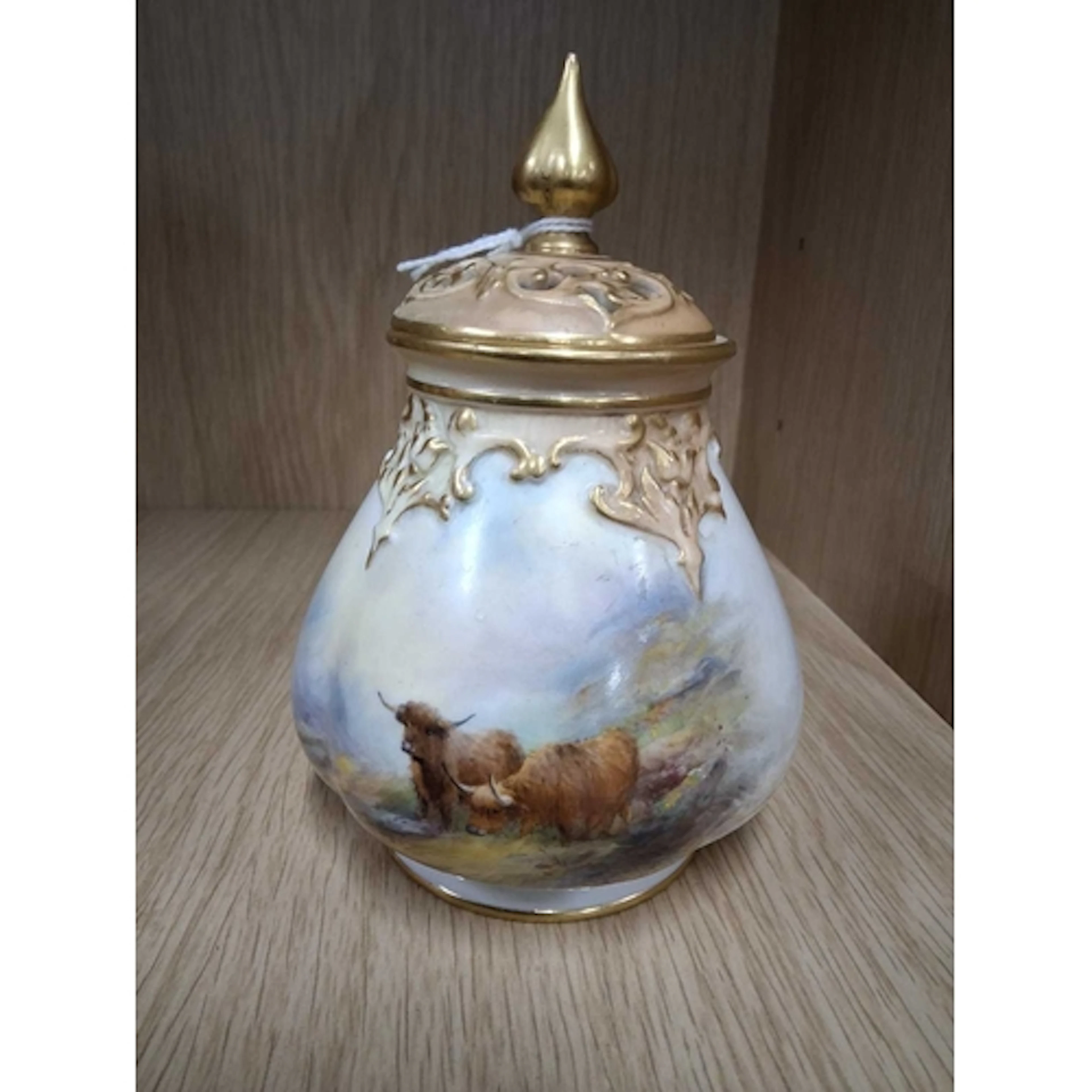 A ROYAL WORCESTER POT POURRI VASE AND COVER, PAINTED BY HARR...