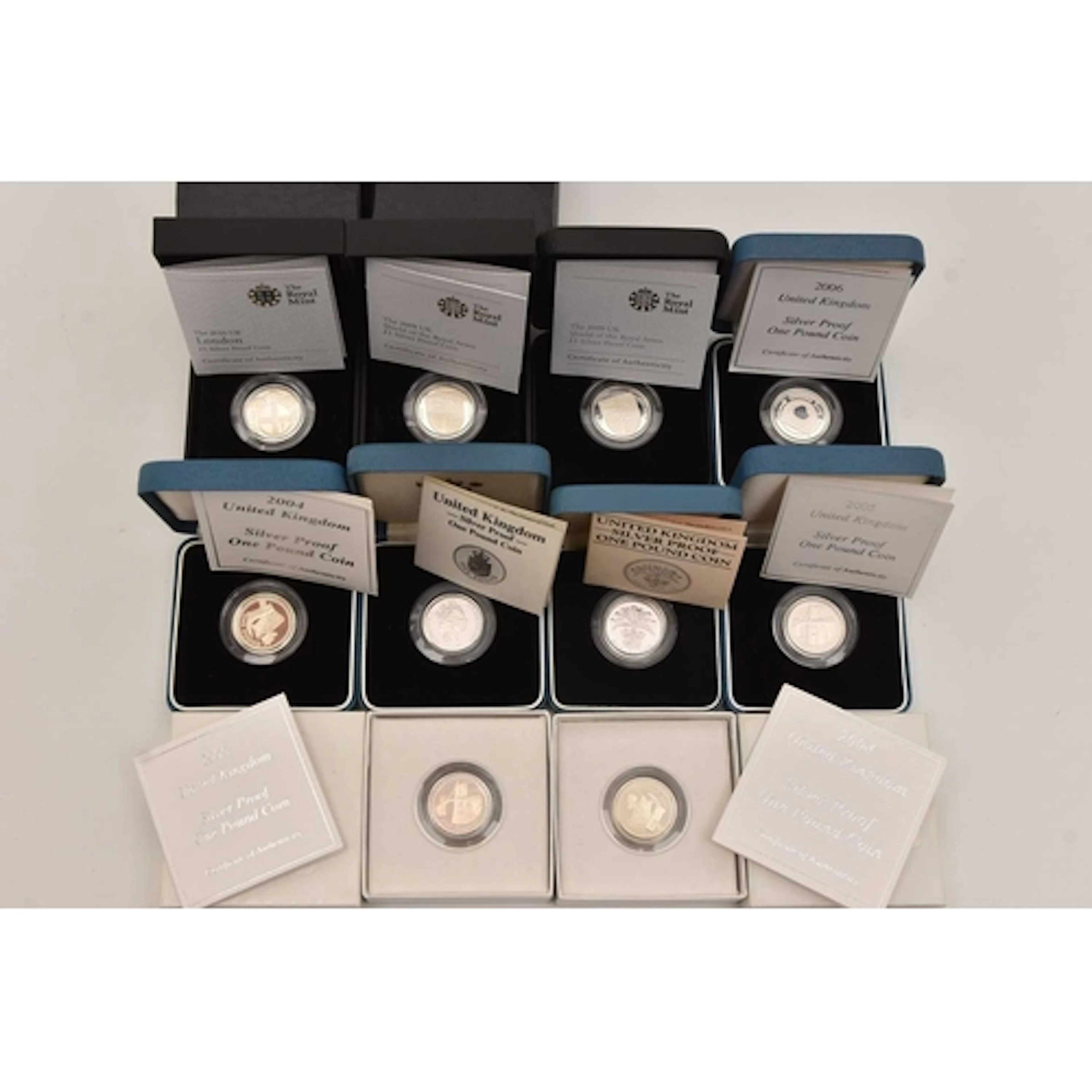 Silver. 10 x cased and boxed UK £1 coins dated 1984, 1988, 2...