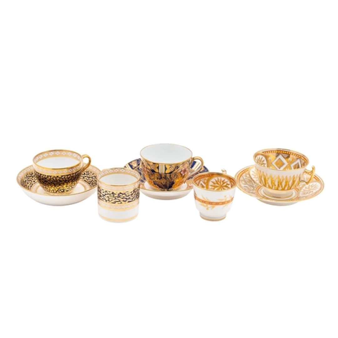 A John Rose Coalport trio; a similar teacup and saucer; and ...