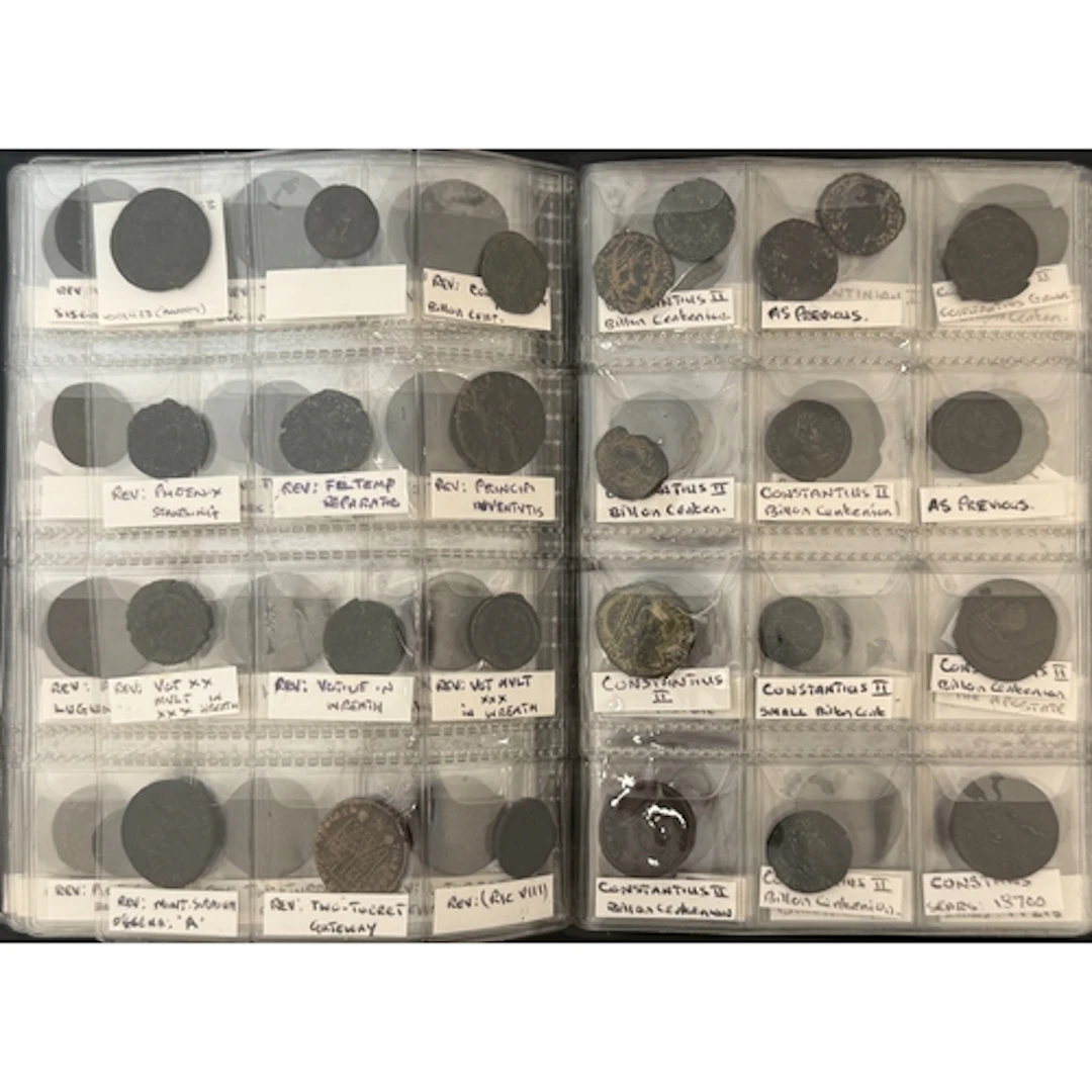 A coin album containing 114 Roman bronze and billon coins, n...