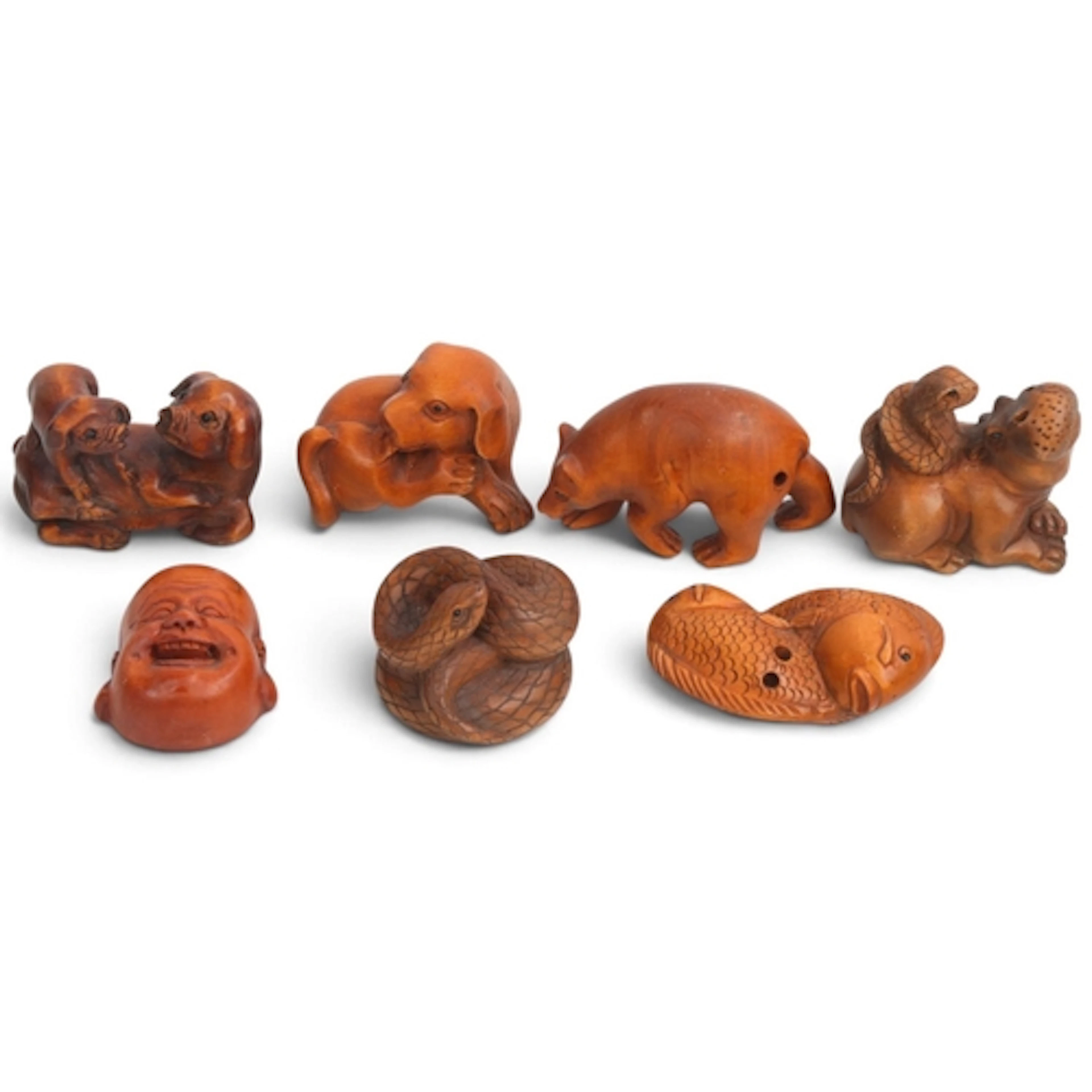A group of 7 Japanese carved wood netsuke