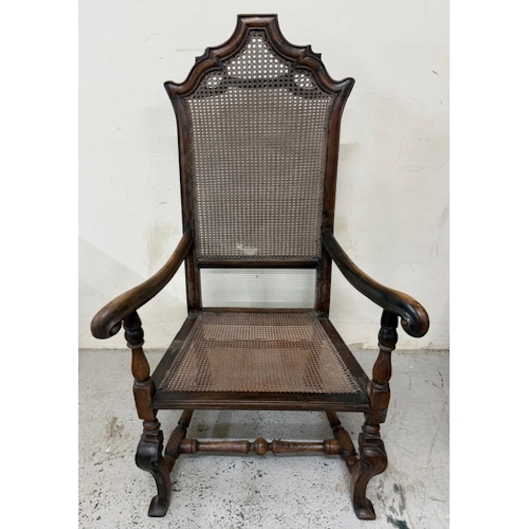 A mahogany William and Mary revival high backed arm chair wi...