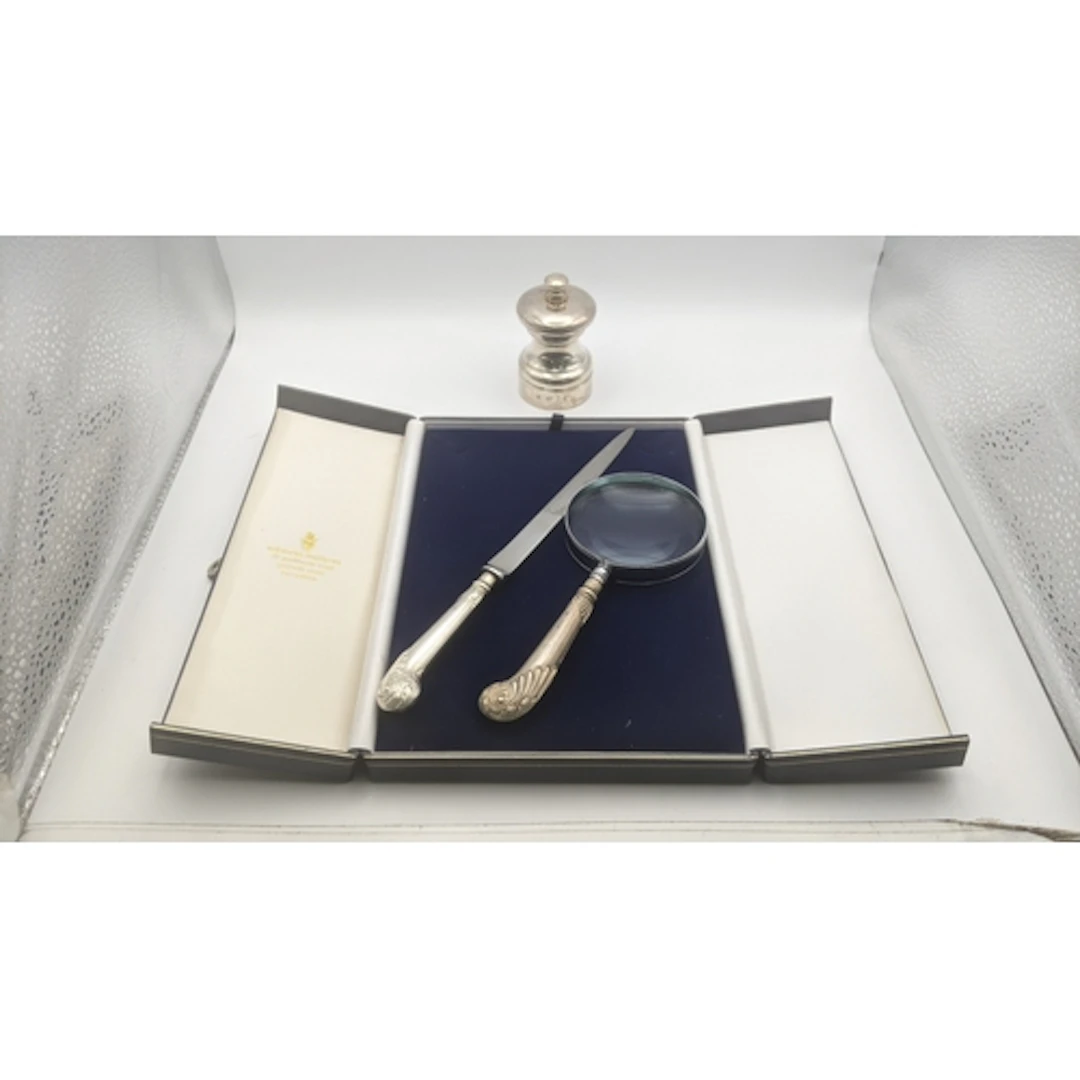 Silver to include a cased silver handled magnifying glass an...