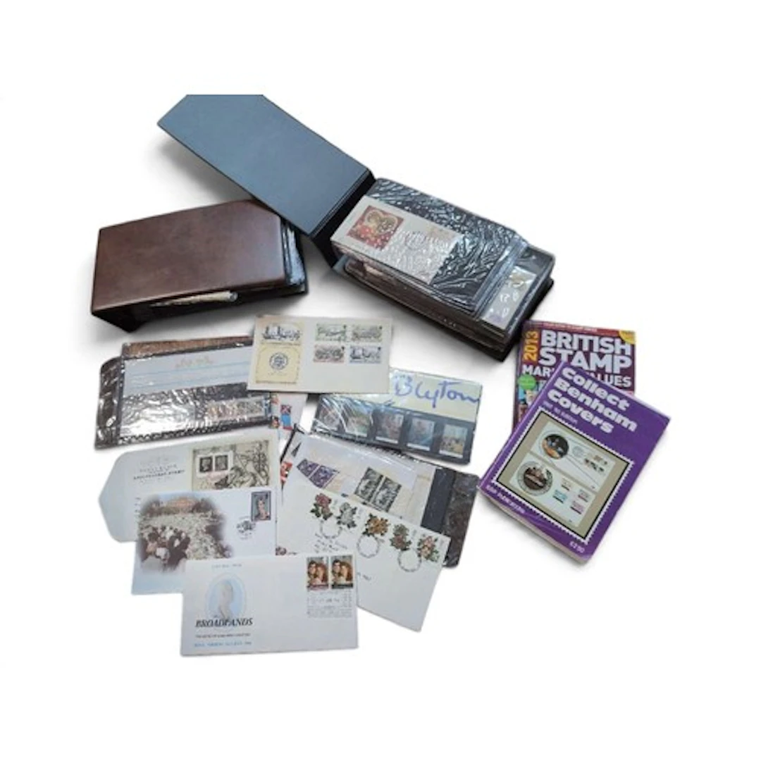 2 full albums plus loose 1st day covers; together with 2 cat...