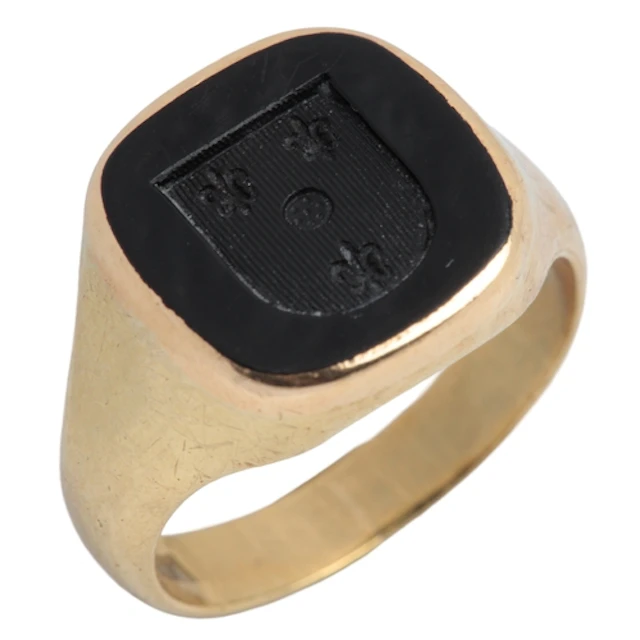 An onyx signet ring, mid 20th century, set with a section of...