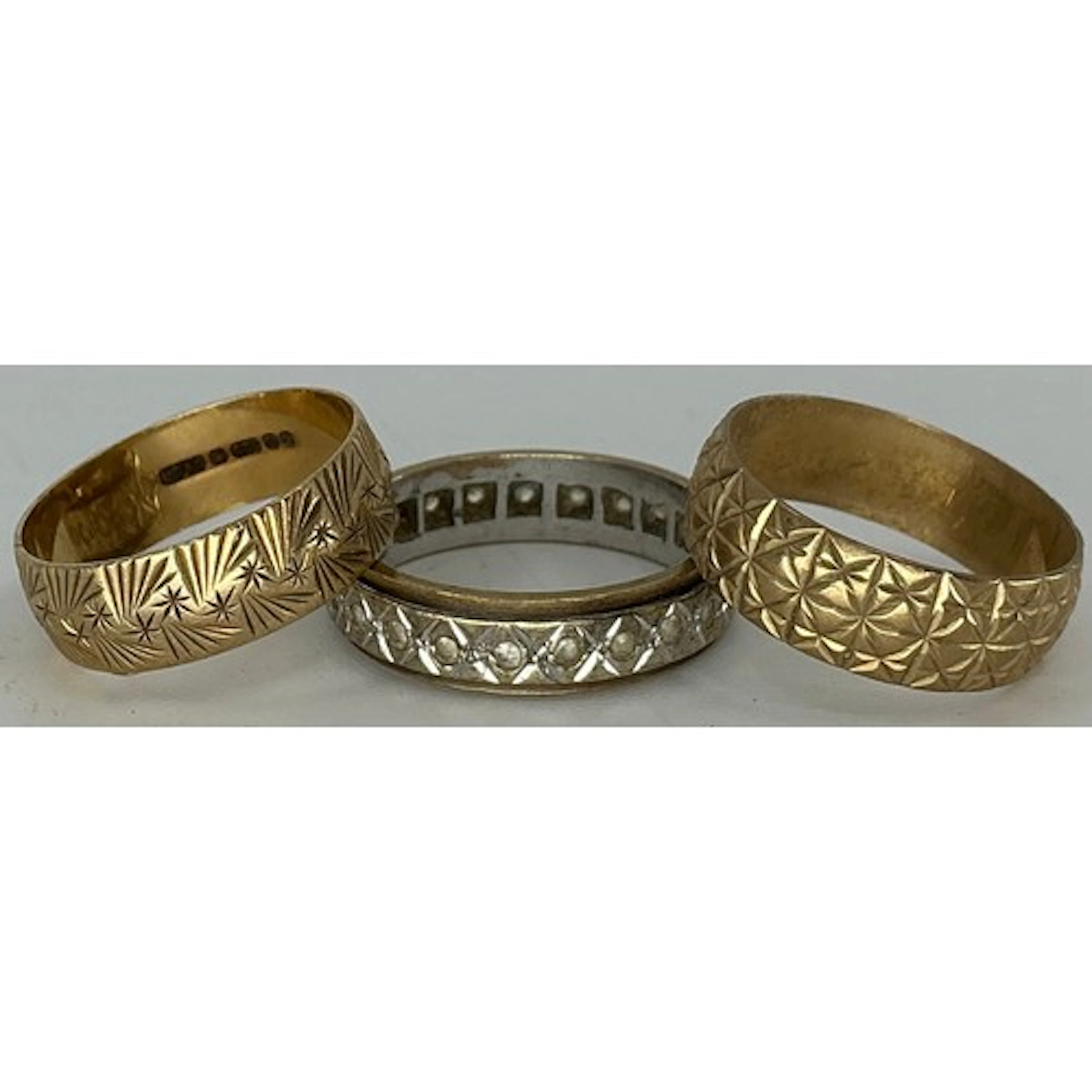 A 9ct gold textured wedding band, size m, another size L; a...