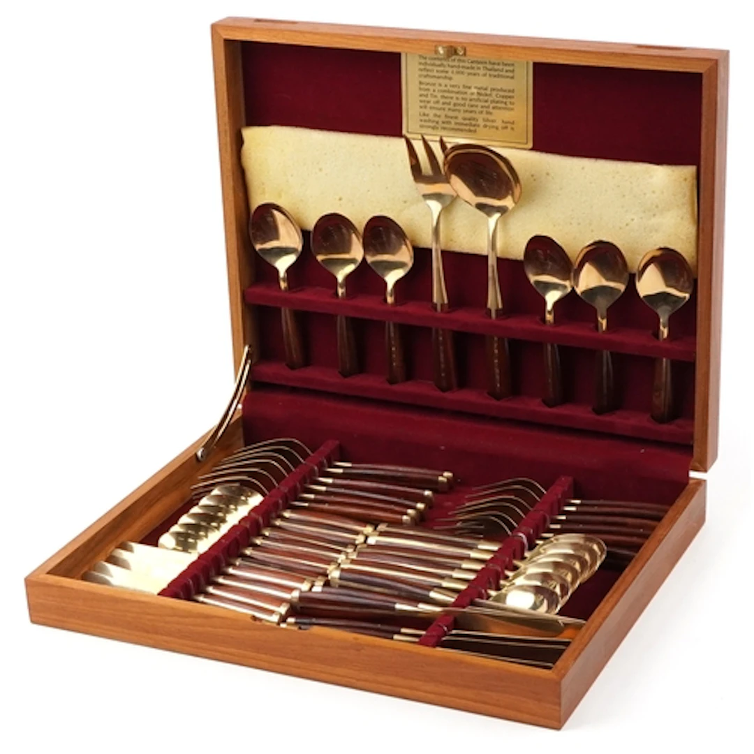 Canteen of Thai bronze cutlery with wooden handles, 41.5cm w...