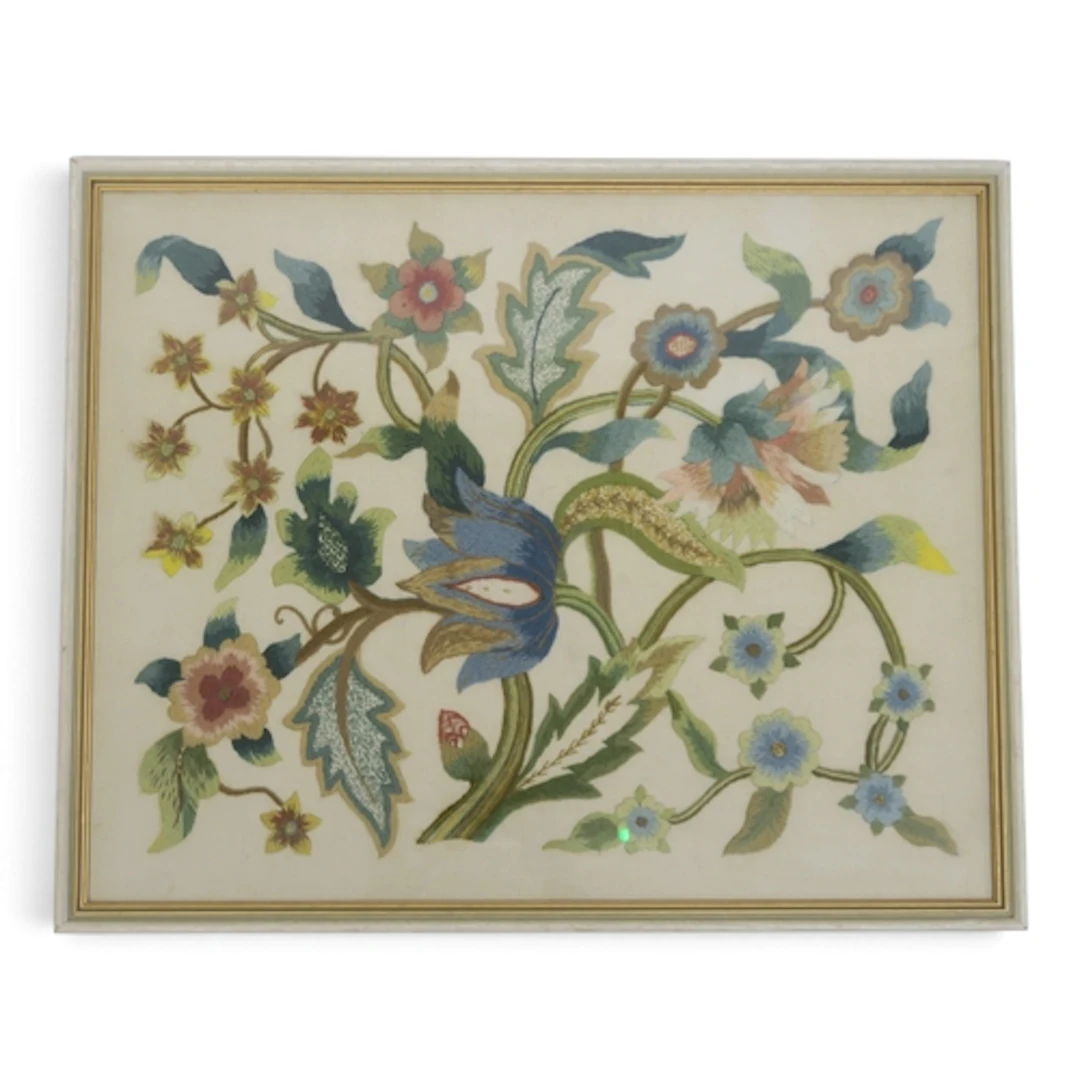 A framed Jacobean-style crewelwork 55.5cm x 45.5cm in...