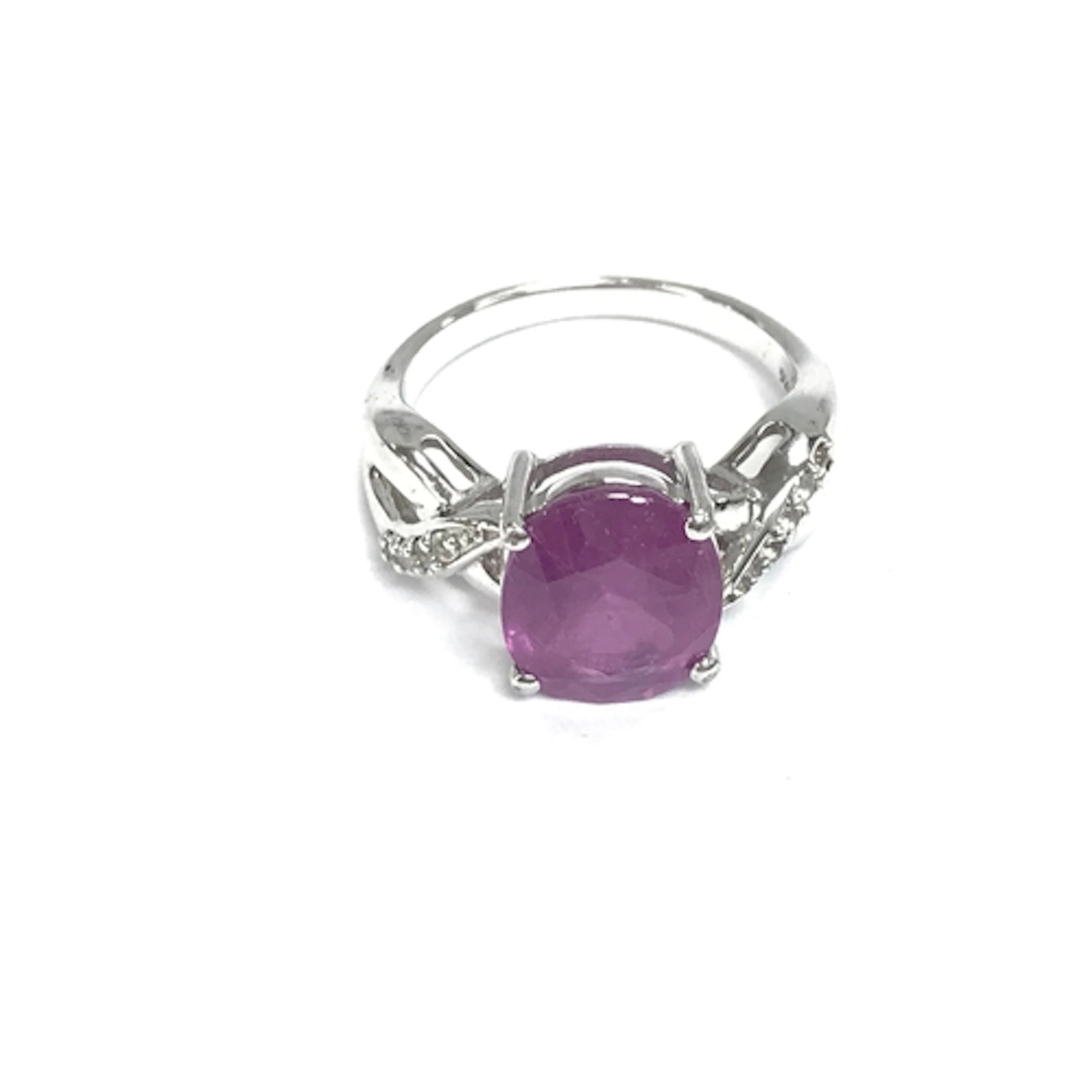 Silver ring set with hot pink sapphire and white topaz. Size...