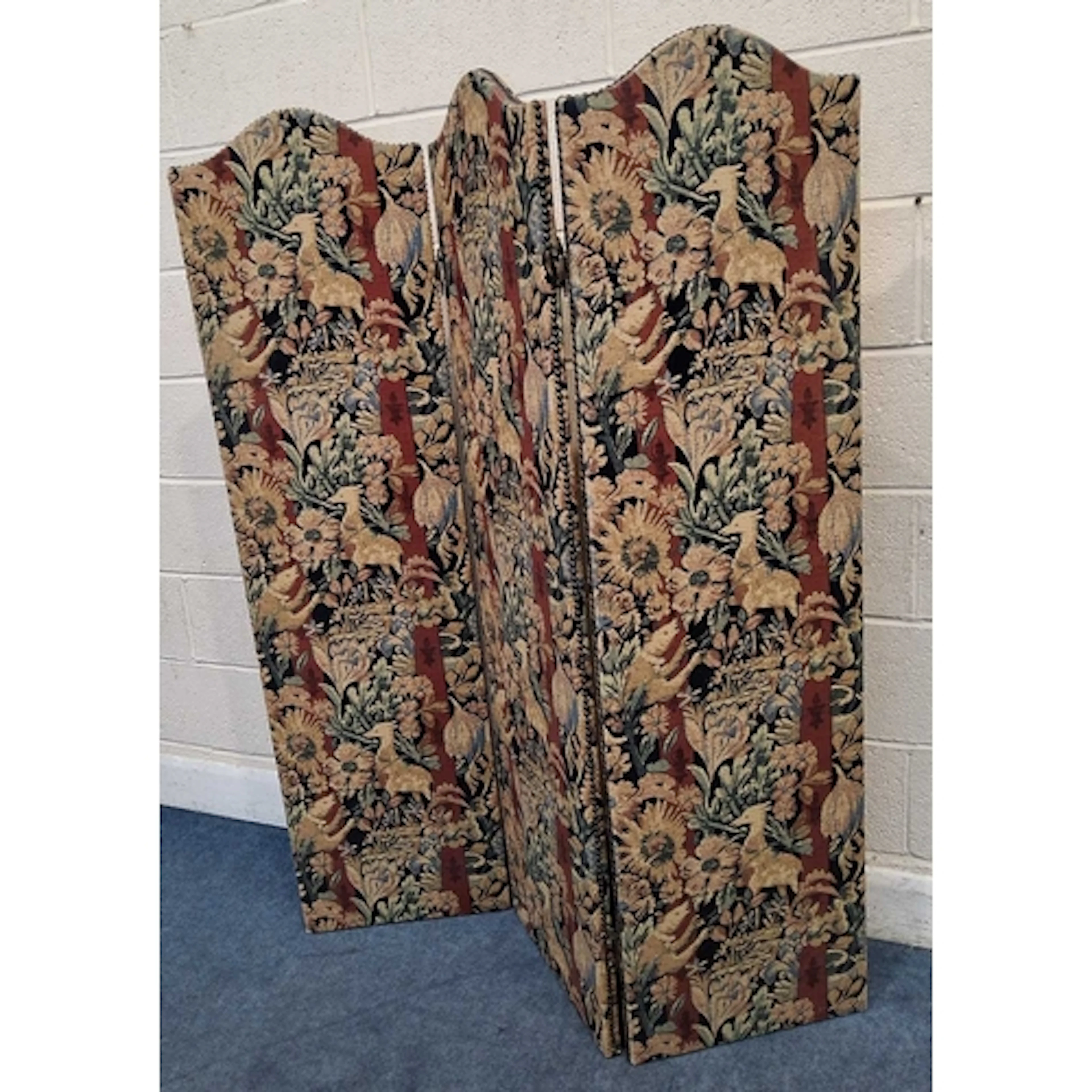 A THREE PANEL FOLDING SCREEN, with an arched top, the fabric...