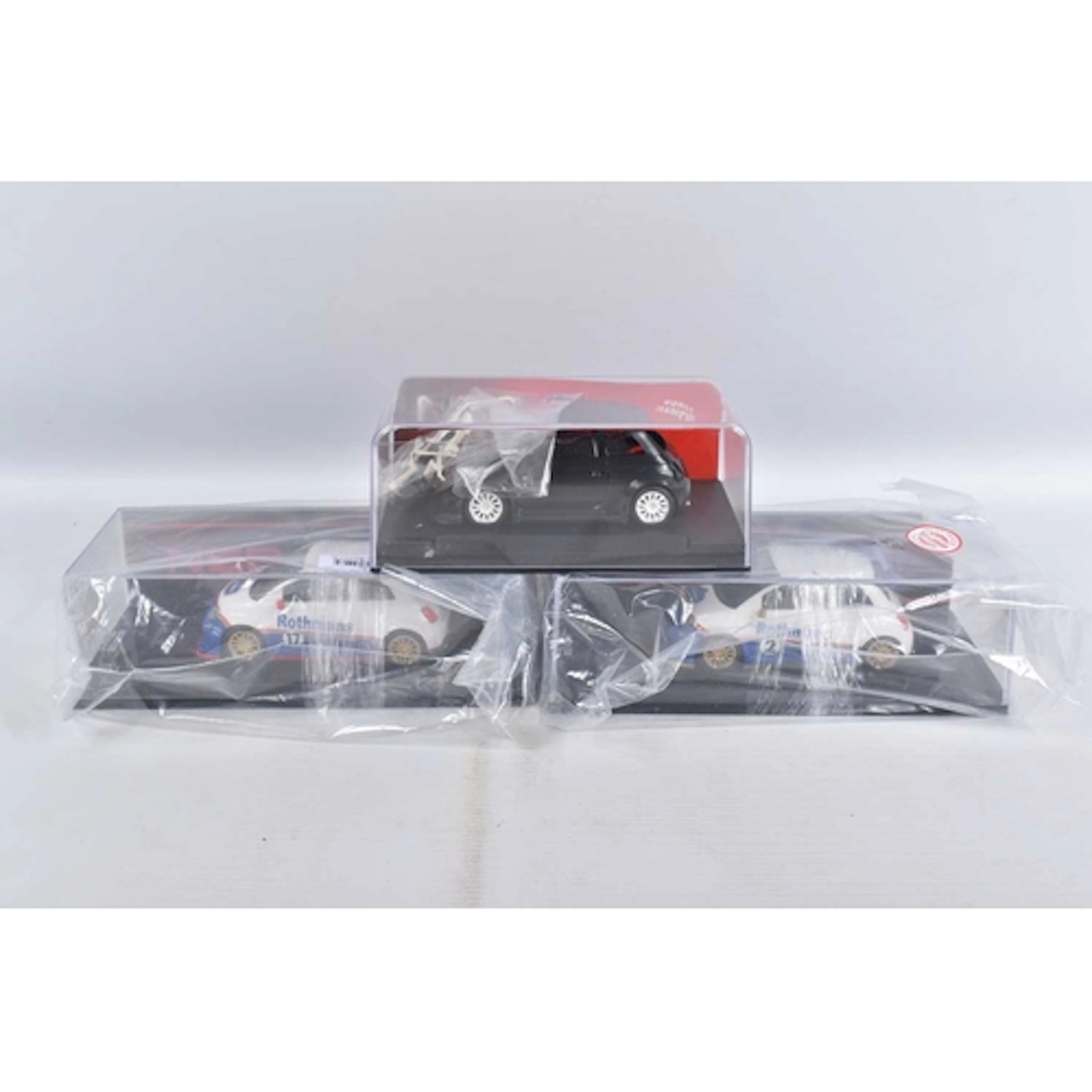 THREE CASED NSR ABARTH MODEL SLOT CARS, to include an Abarth...