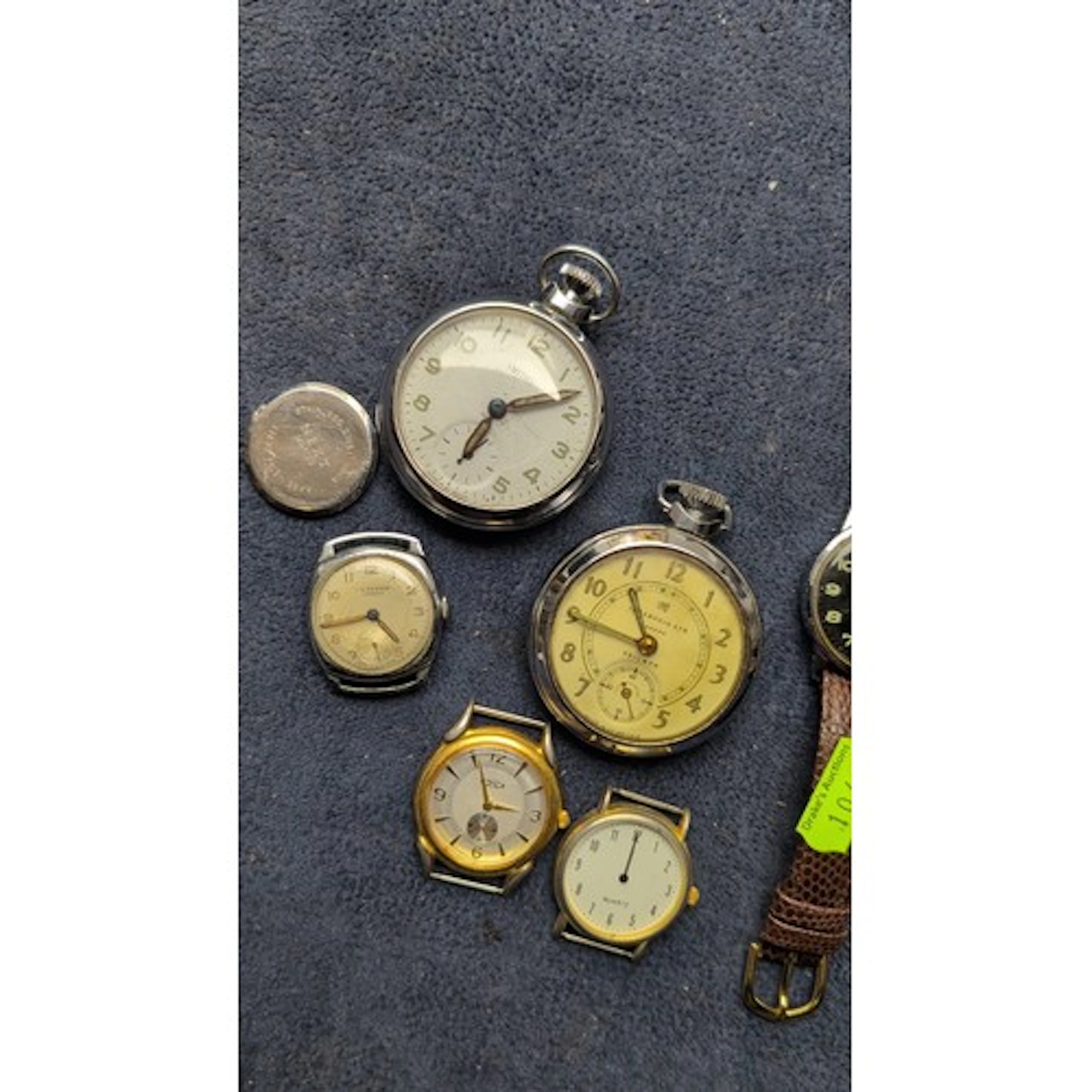 A group of vintage timepieces comprising two pocket watches,...