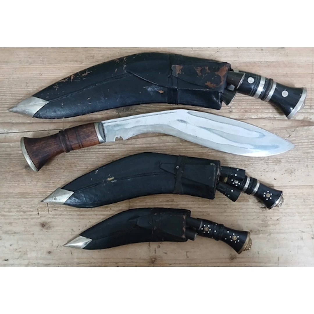 A group of four kukri knives.