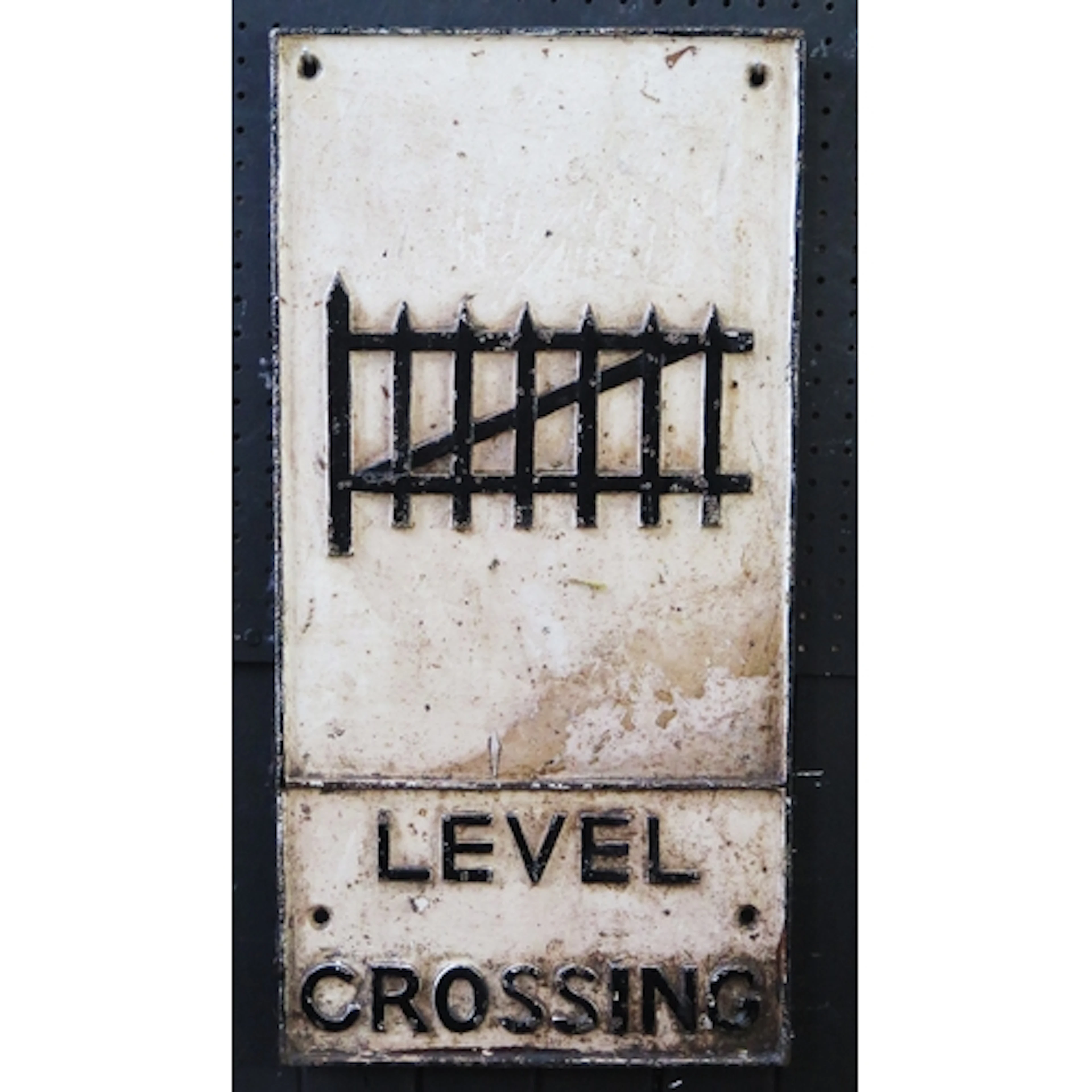A cast iron road sign "Level Crossing", 59 x 28cm.