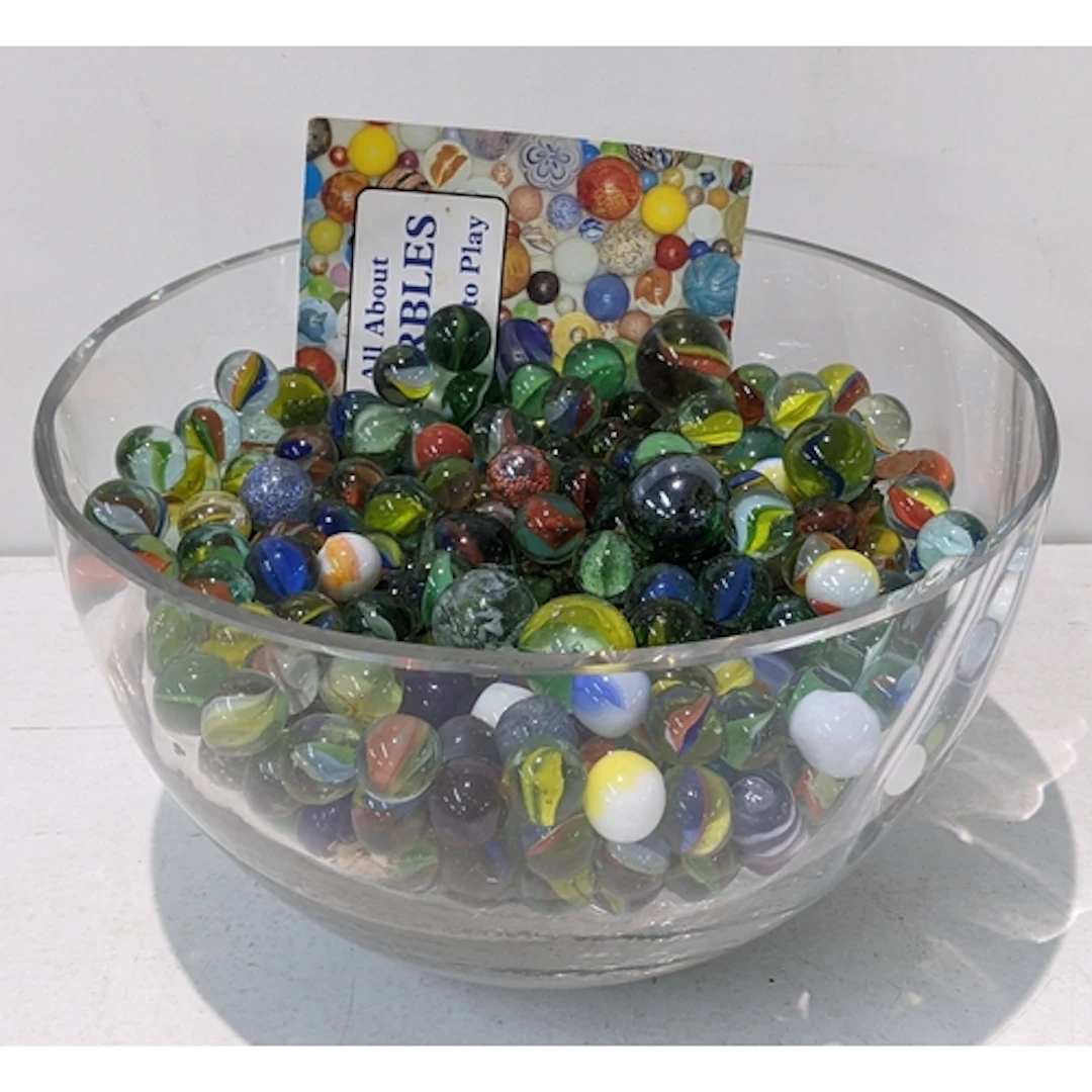 A collection of marbles to include air twist examples Locati...