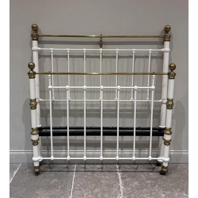 A Victorian cast iron and lacquered brass double bed frame, ...
