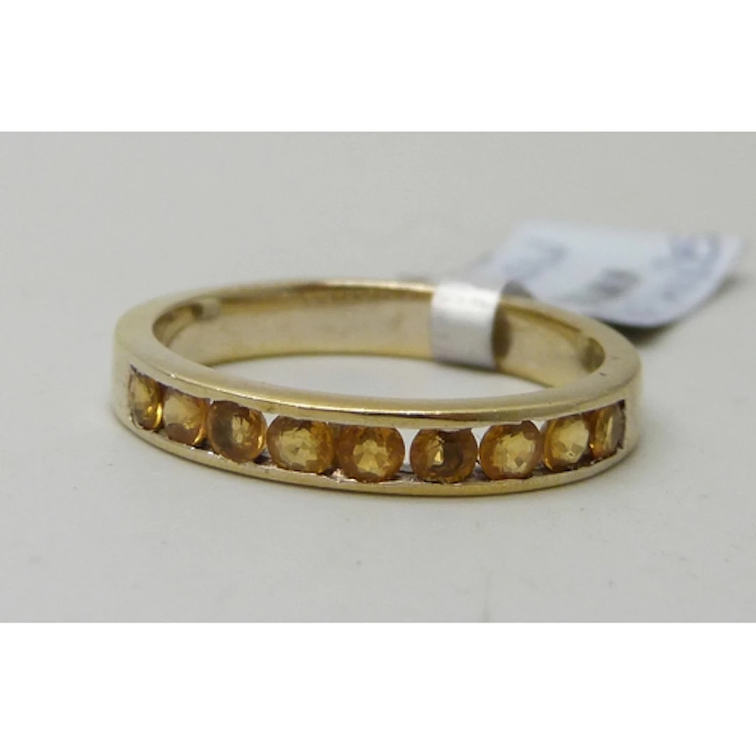 A TGGC silver gilt and possibly yellow sapphire nine stone r...