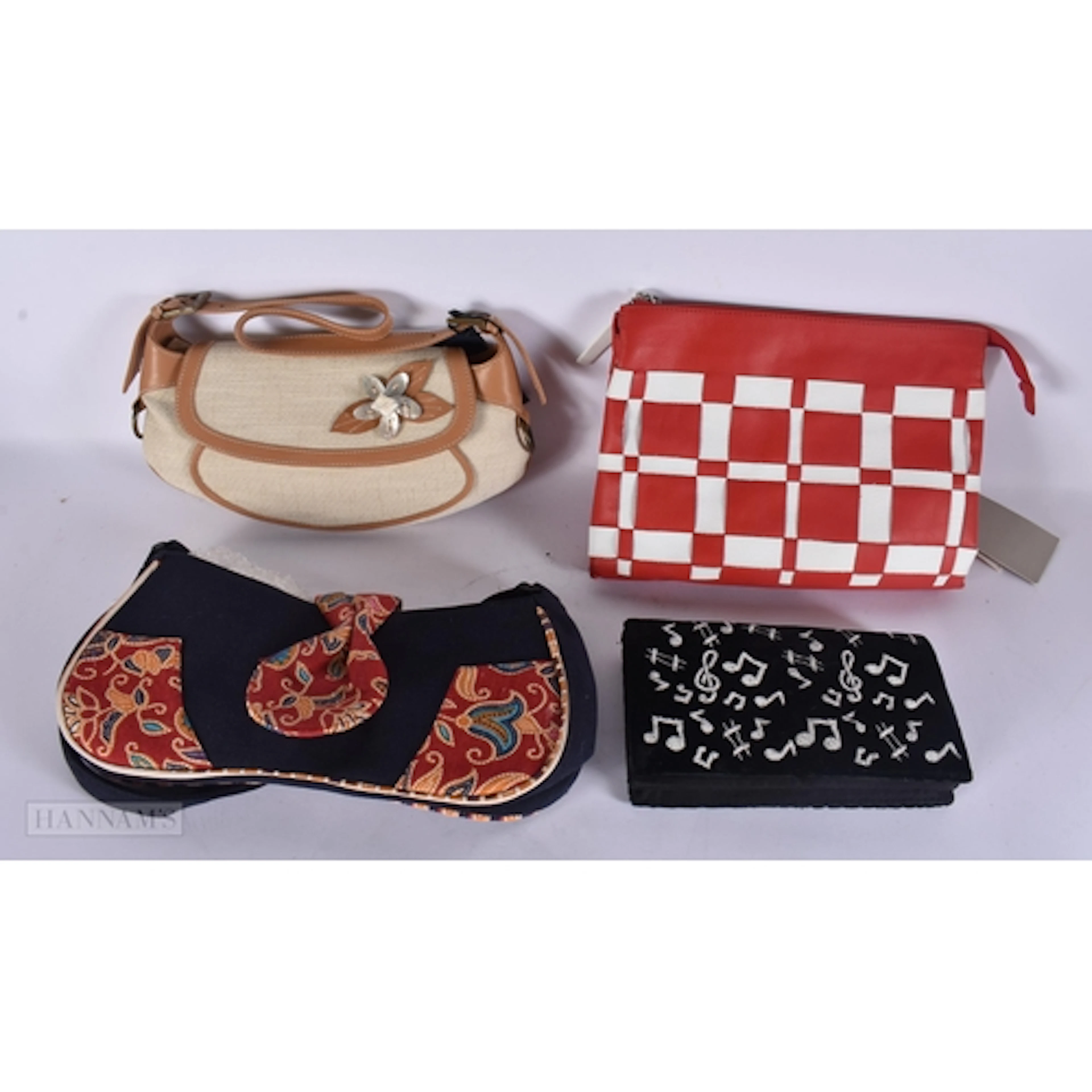A PIERRE CARDIN LEATHER HANDBAG and three others. (4)