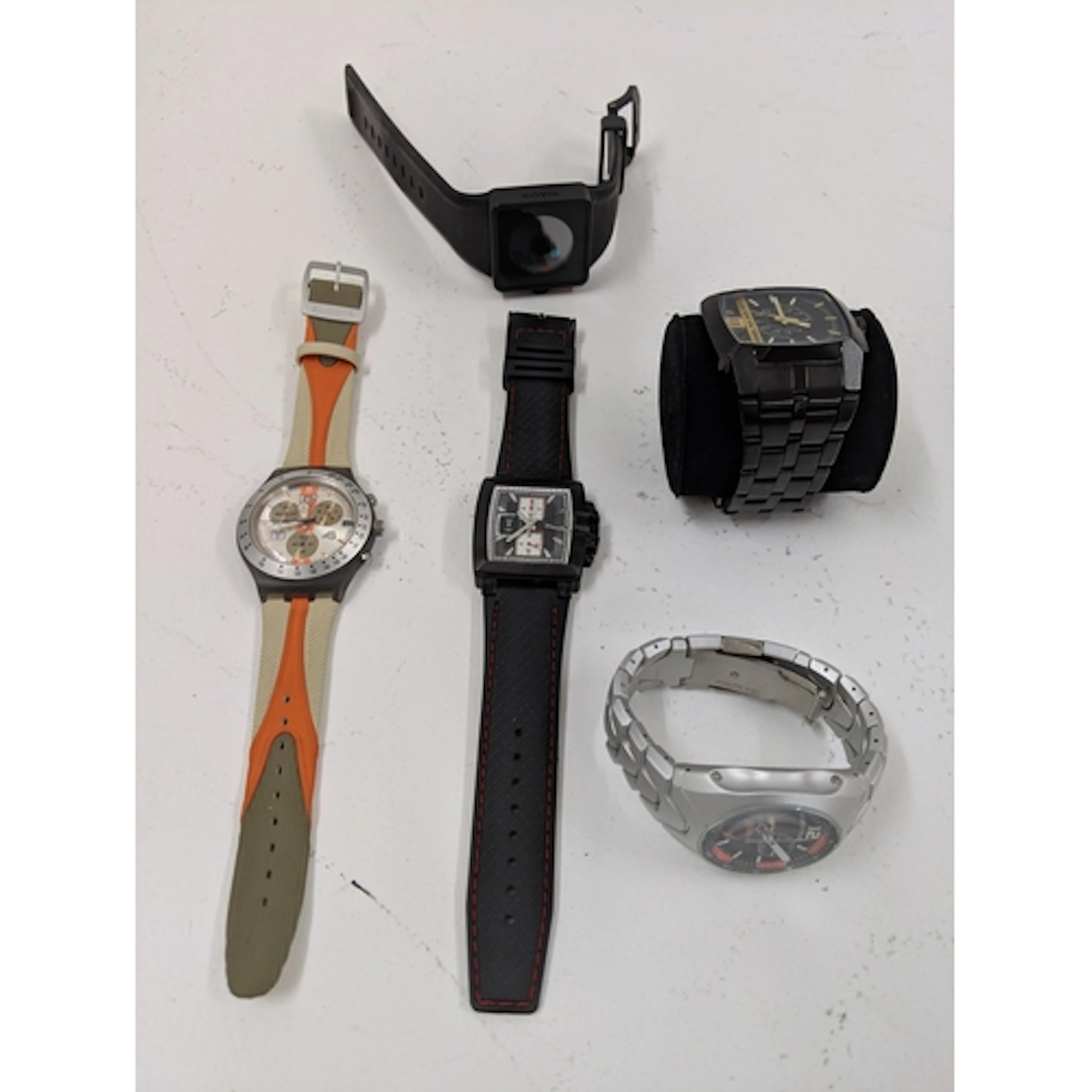 Wristwatches to include a Swatch watch, a Nixon, a Sector, a...
