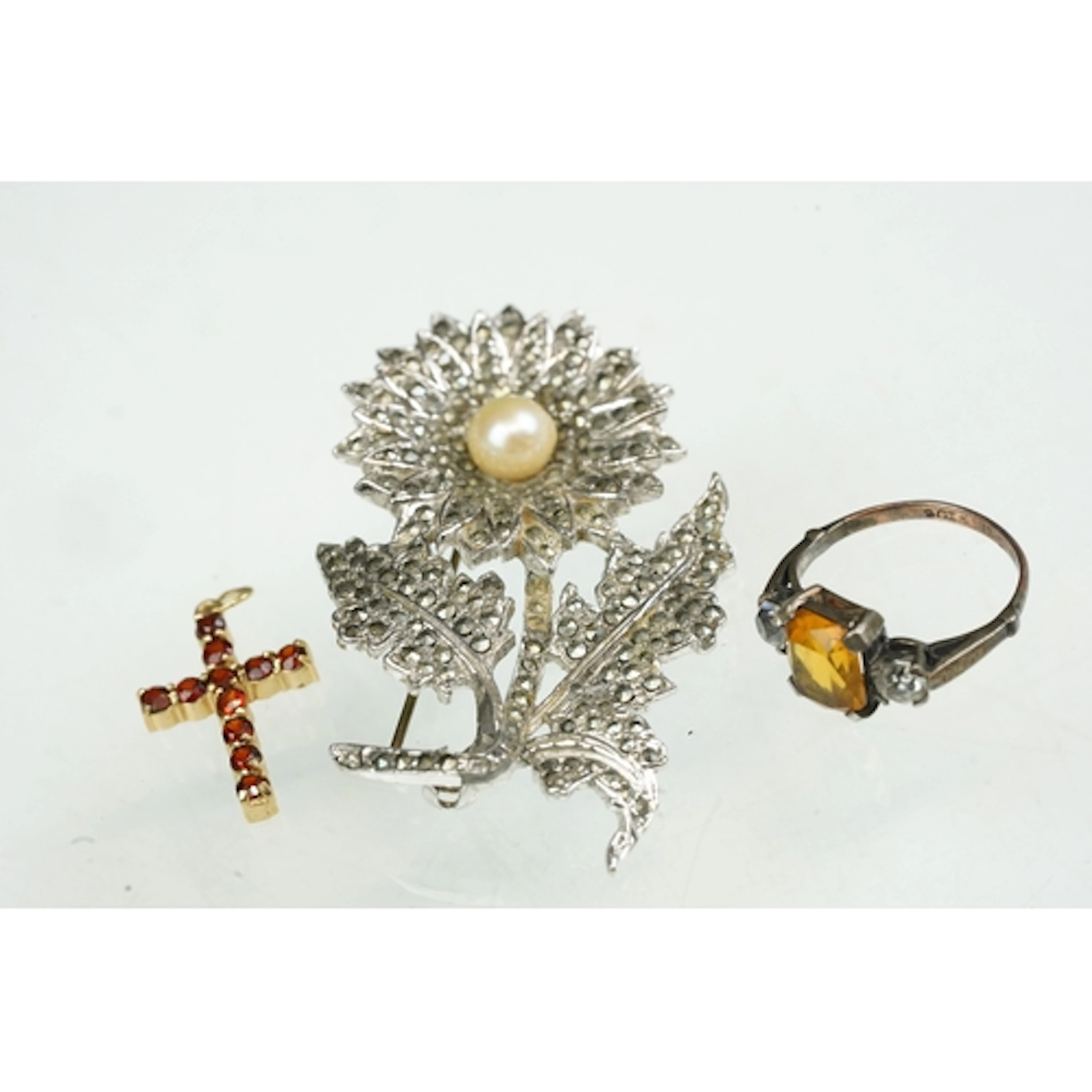 9ct gold and silver ring having an emerald-cut central orang...