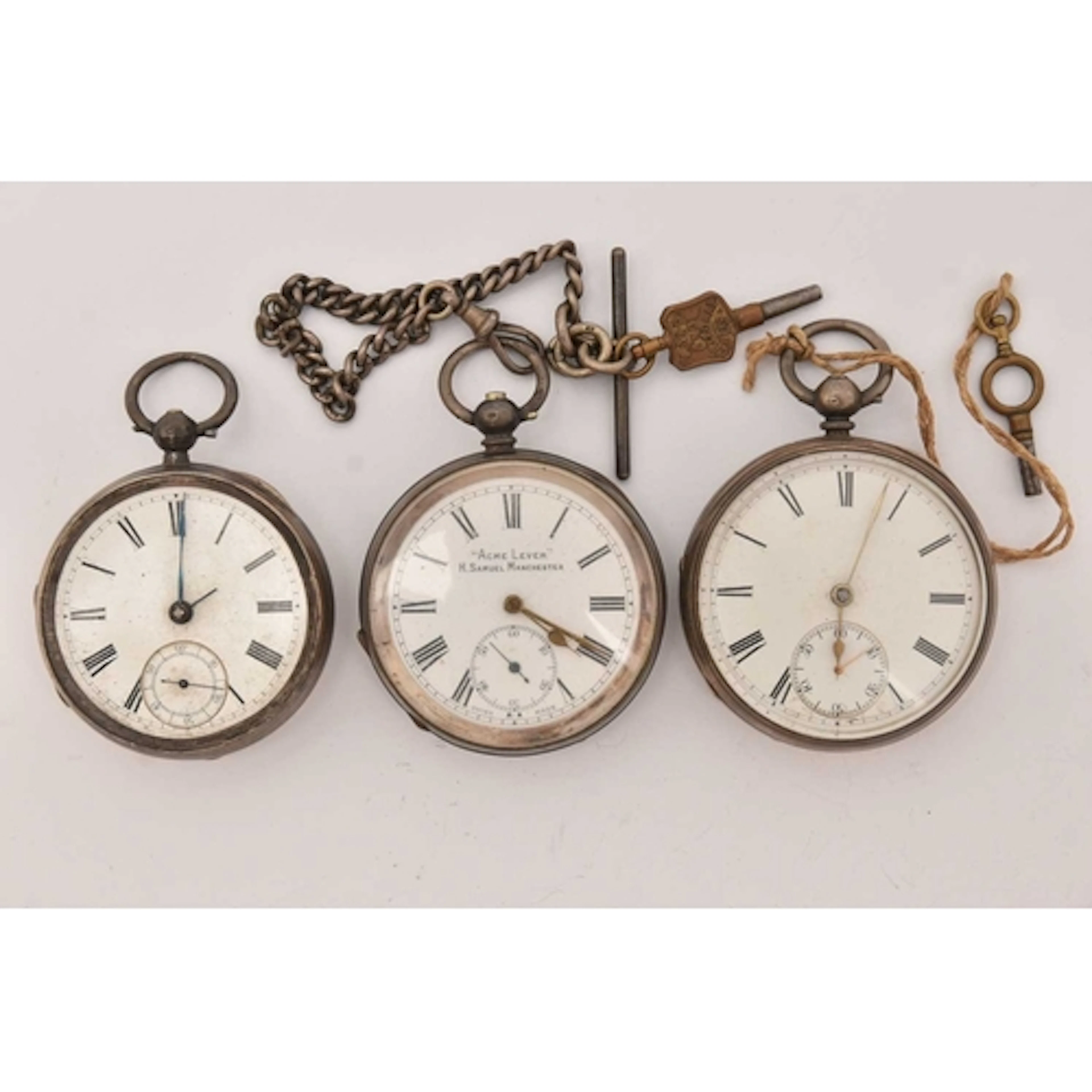 THREE SILVER OPEN FACE POCKET WATCHES, the first a key wound...
