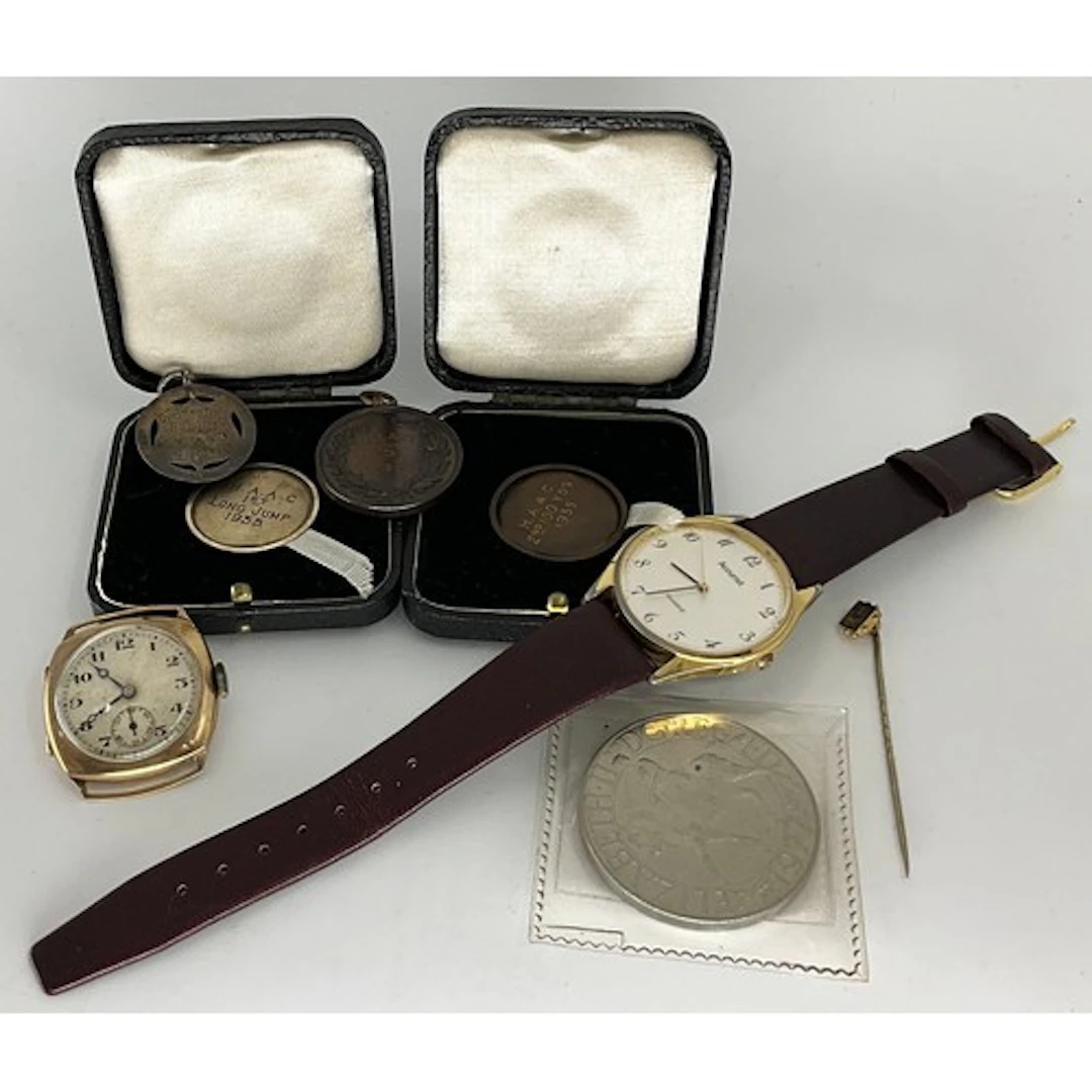 A 1920s/30s 9ct gold cased wristwatch head, sunburst texture...