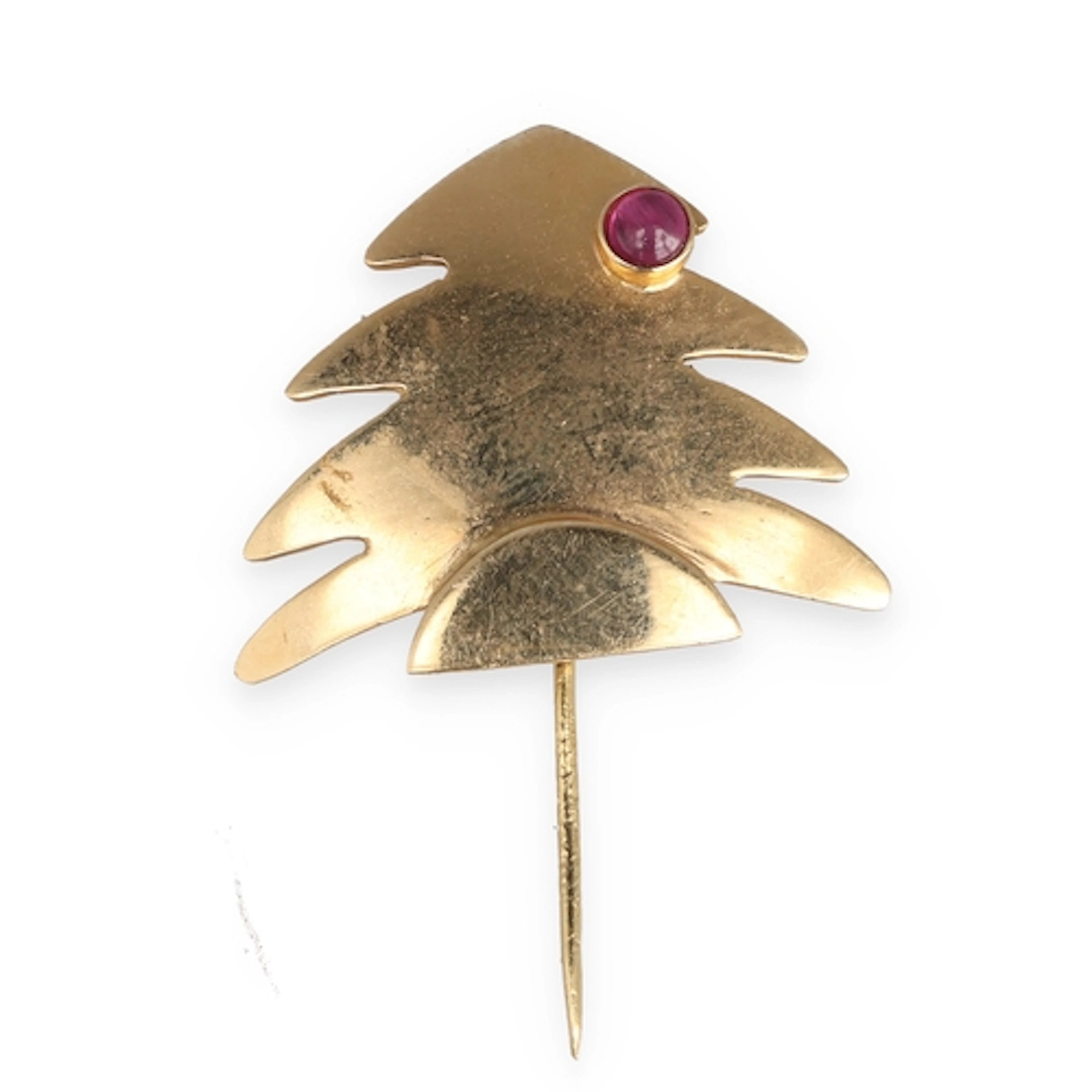 A 9CT GOLD CHRISTMAS TREE BROOCH Set with a ruby. Weight: 4g...