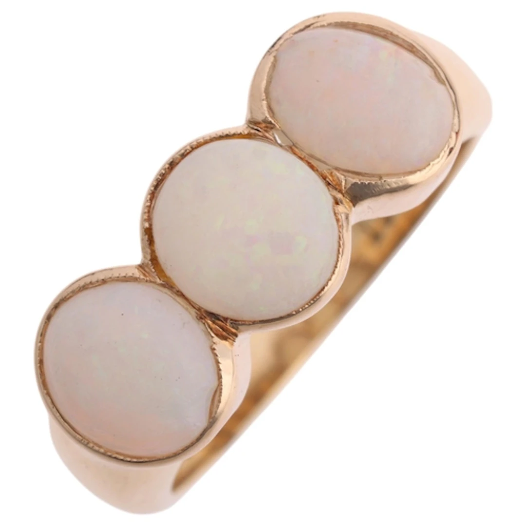 A Vintage 9ct gold three stone opal ring, rub-over set with ...